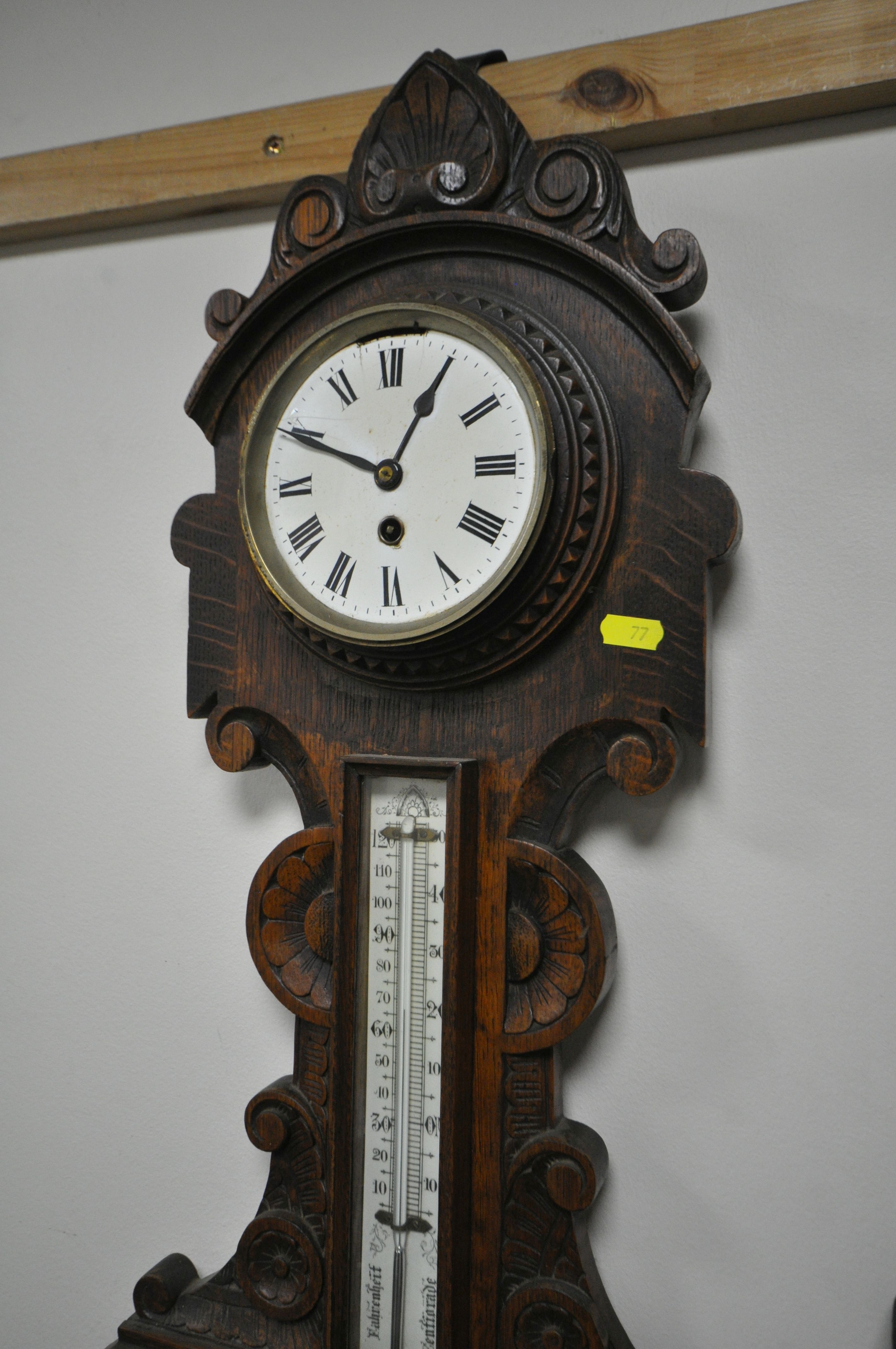 TWO LATE 19TH/EARLY 20TH CENTURY CARVED OAK ANEROID BAROMETERS, with clock dials and thermometers, - Image 2 of 5