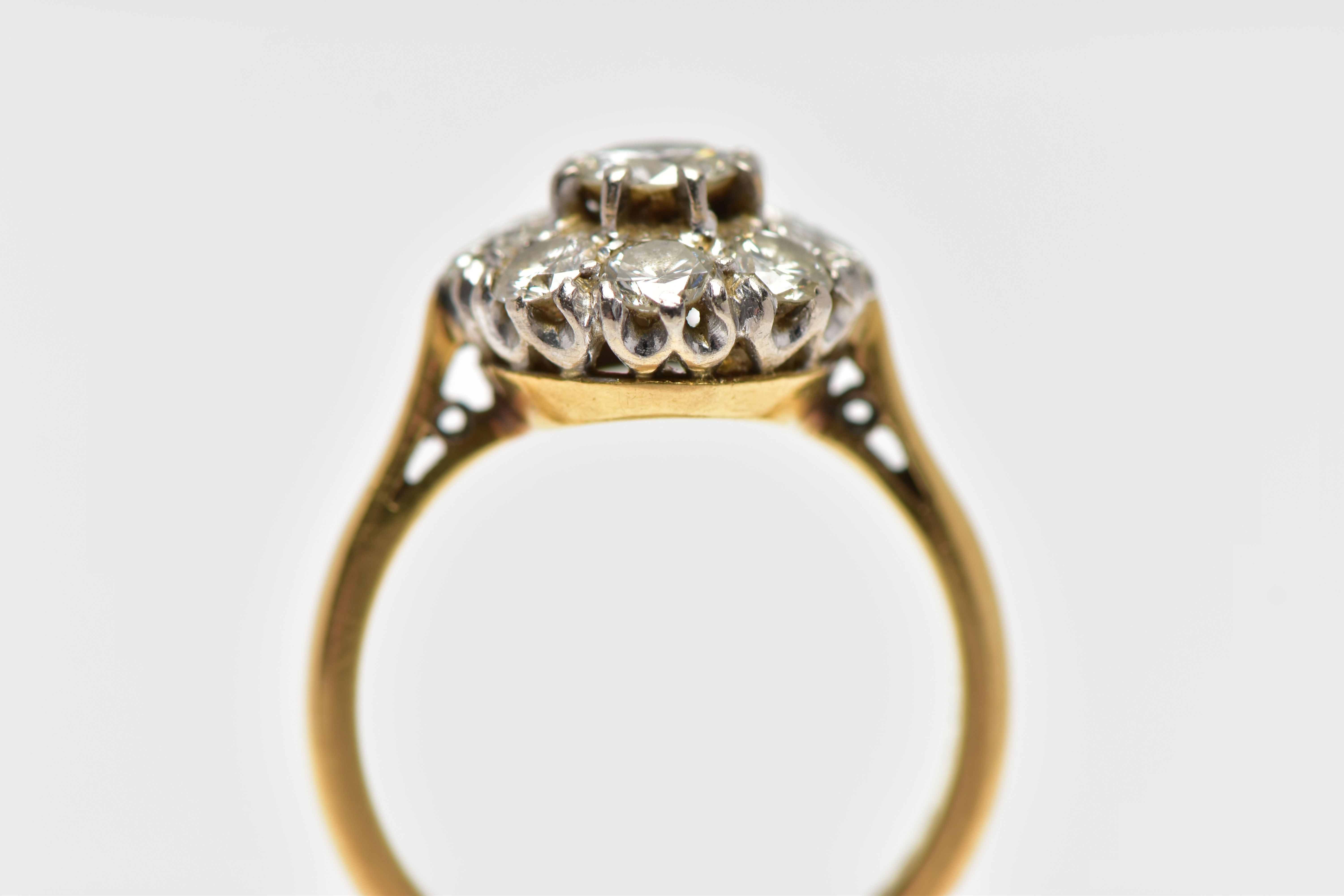 A DIAMOND NINE STONE CLUSTER RING, set with a principal round brilliant cut diamond, surrounded by - Image 7 of 9