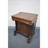 AN EARLY 19TH CENTURY ROSEWOOD DAVENPORT DESK, having a brass open fretwork gallery behind a leather