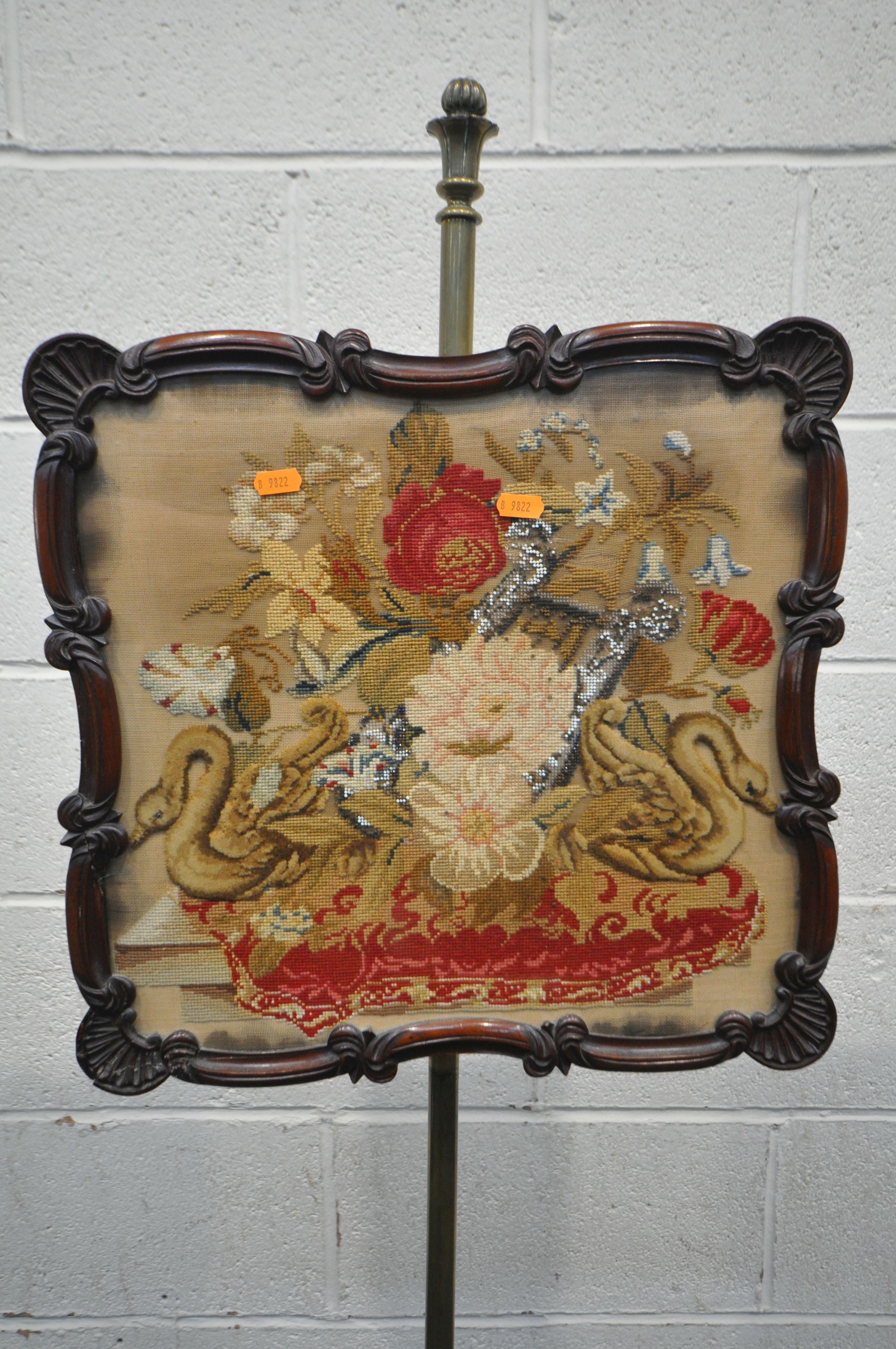 A VICTORIAN WALNUT POLE SCREEN, the shaped frame with a glass panel enclosing a needlework - Image 2 of 4