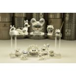 ELEVEN BOXED SWAROVSKI CRYSTAL ORNAMENTS, from various collections, comprising five from Woodland