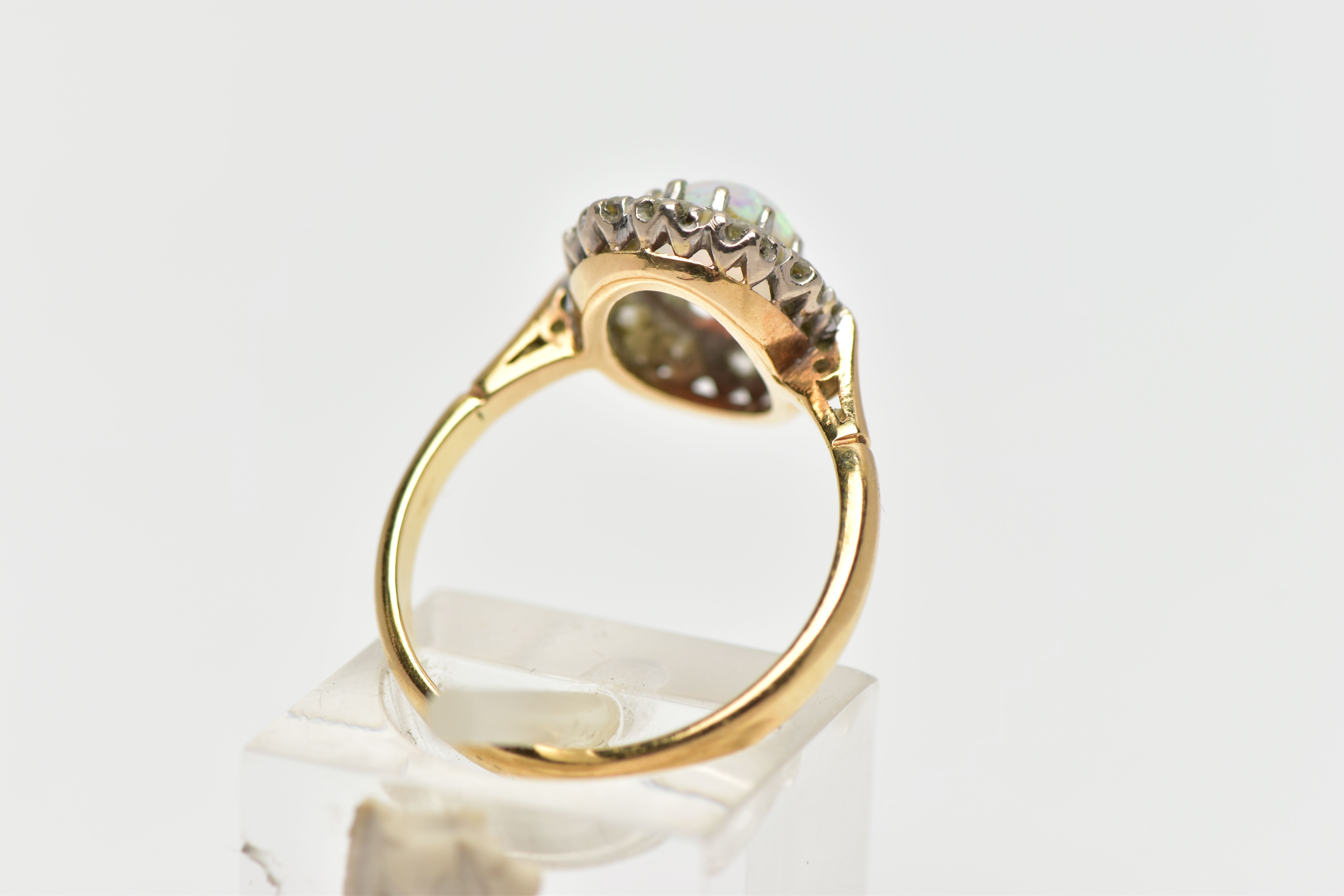 AN OPAL AND DIAMOND CLUSTER RING, set with an oval opal cabochon, measuring approximately 8.2mm x - Image 3 of 10