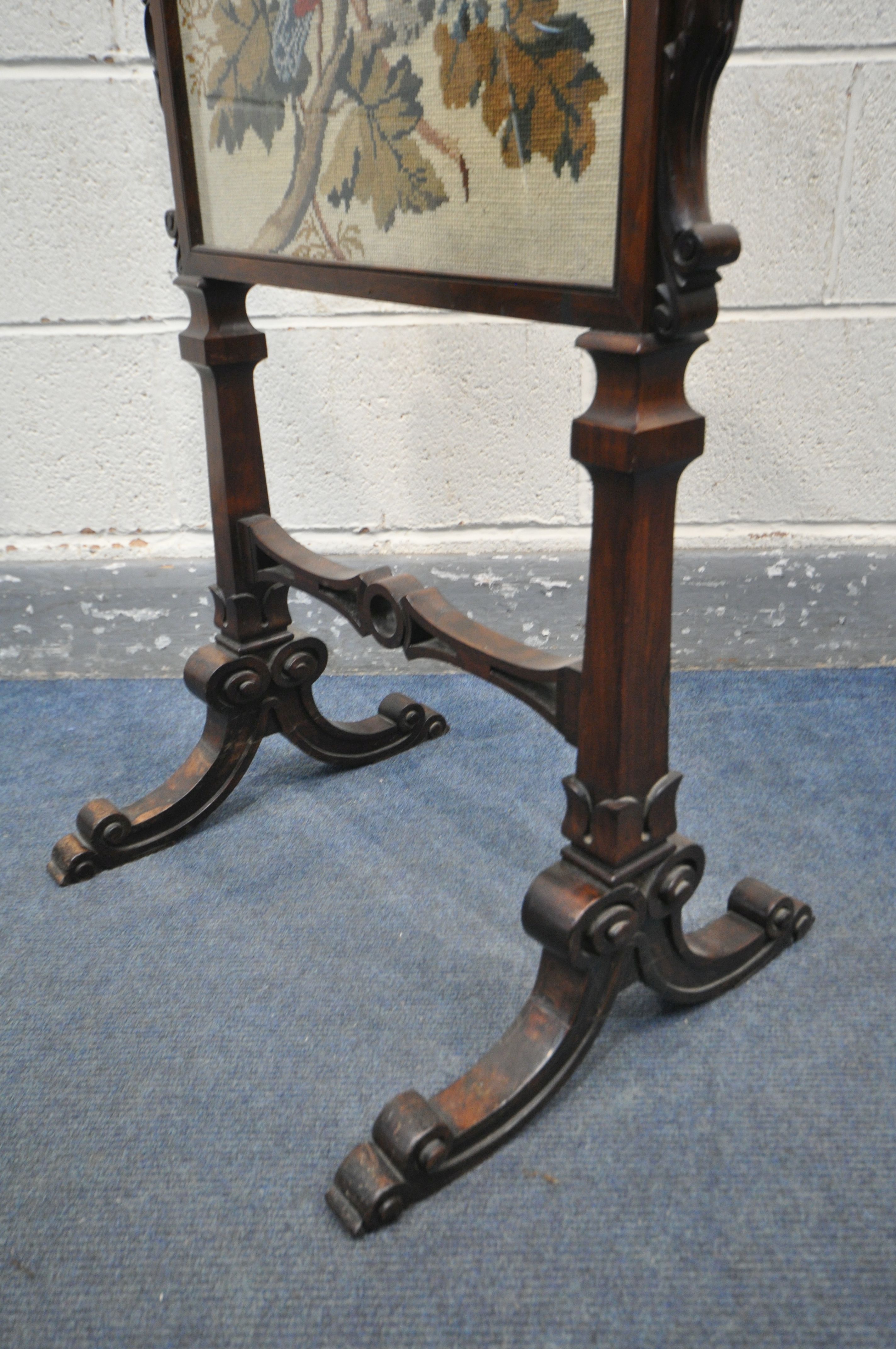 AN EARLY VICTORIAN ROSEWOOD FIRESCREEN, the frame with foliate scrolls, the glass panel enclosing - Image 4 of 5