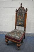 A VICTORIAN POLLARD OAK NURSING CHAIR, the detailed high back with triple acanthus leaf finials