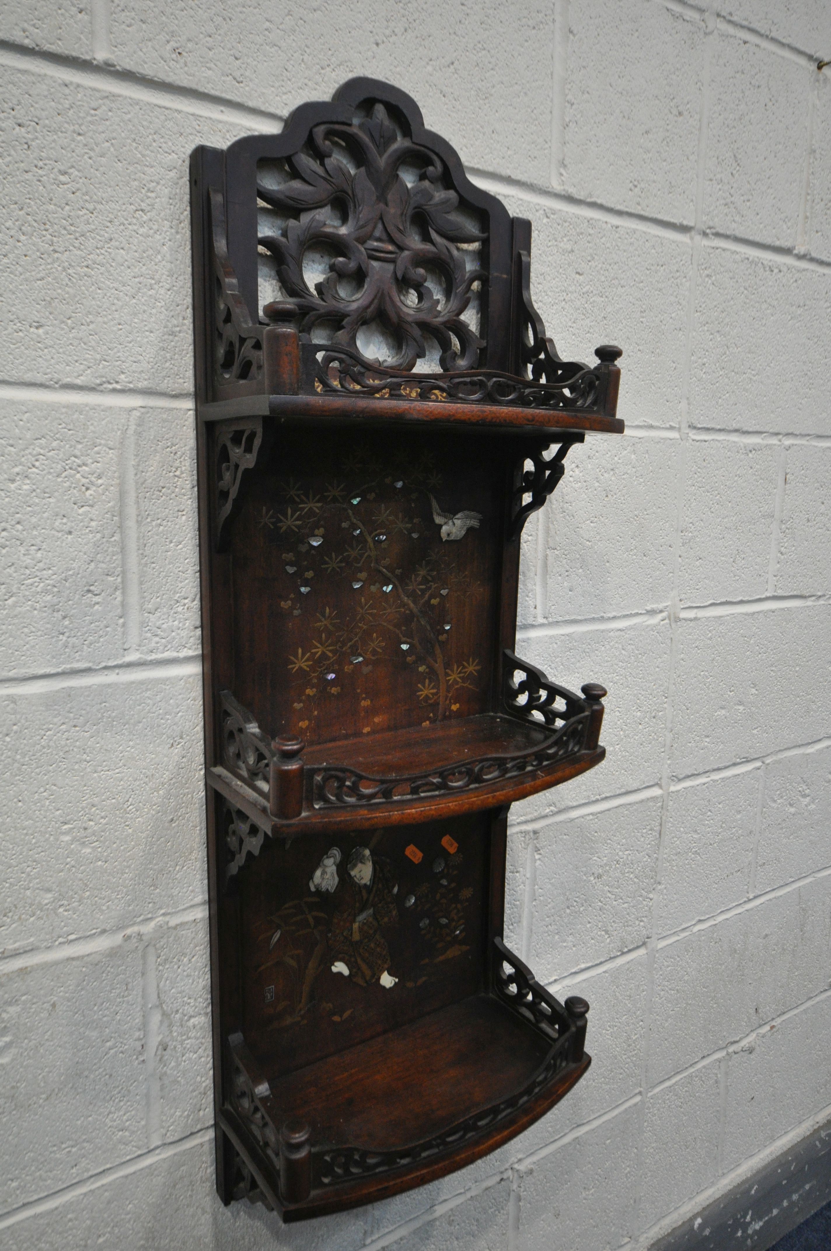 A 20TH CENTURY HARDWOOD JAPANNED WALL SHELF, made up of three shelves, with open foliate fretwork - Image 2 of 6