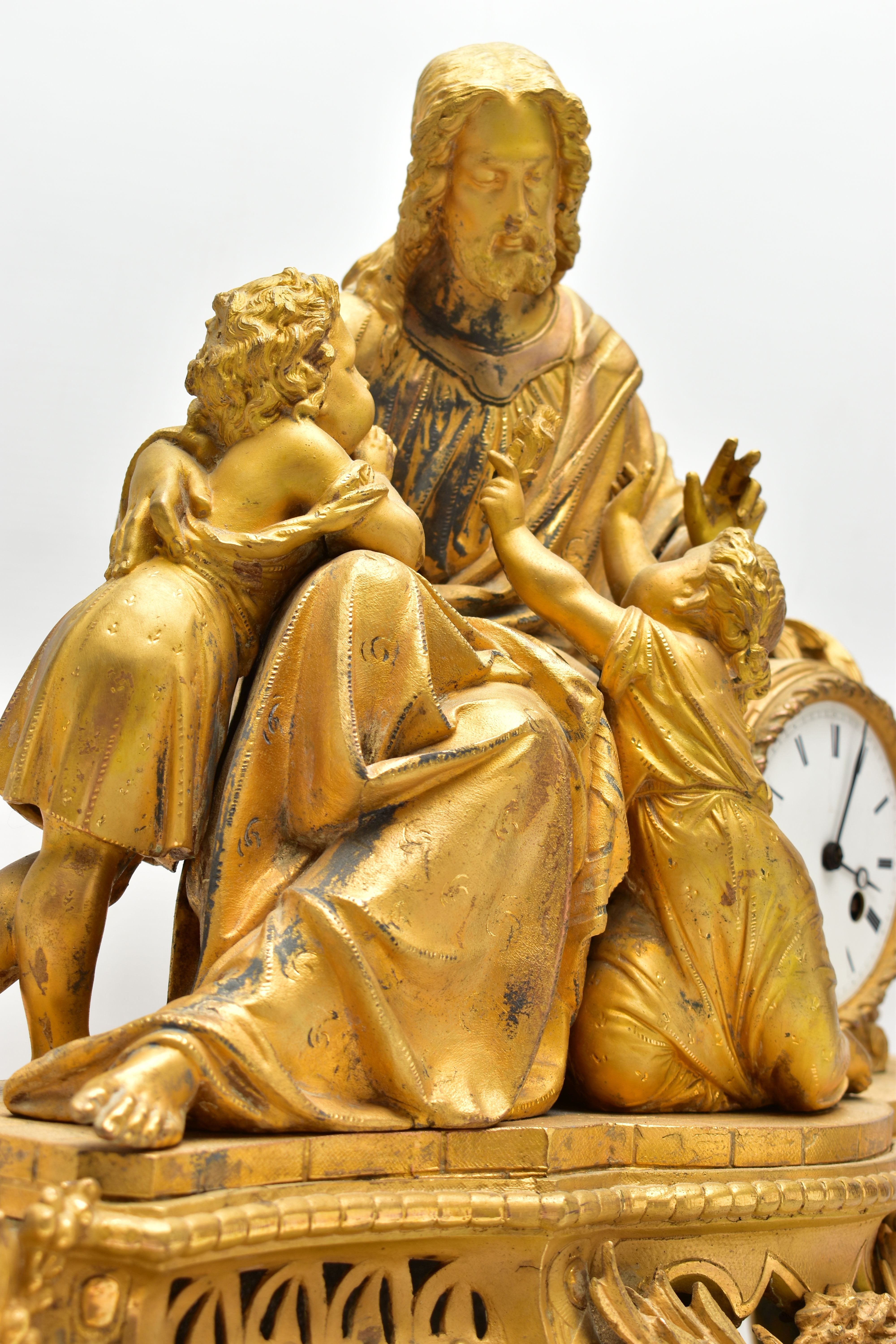 A MID 19TH CENTURY GILT METAL MANTEL CLOCK, cast with a seated figure of Christ and two children, - Image 7 of 11