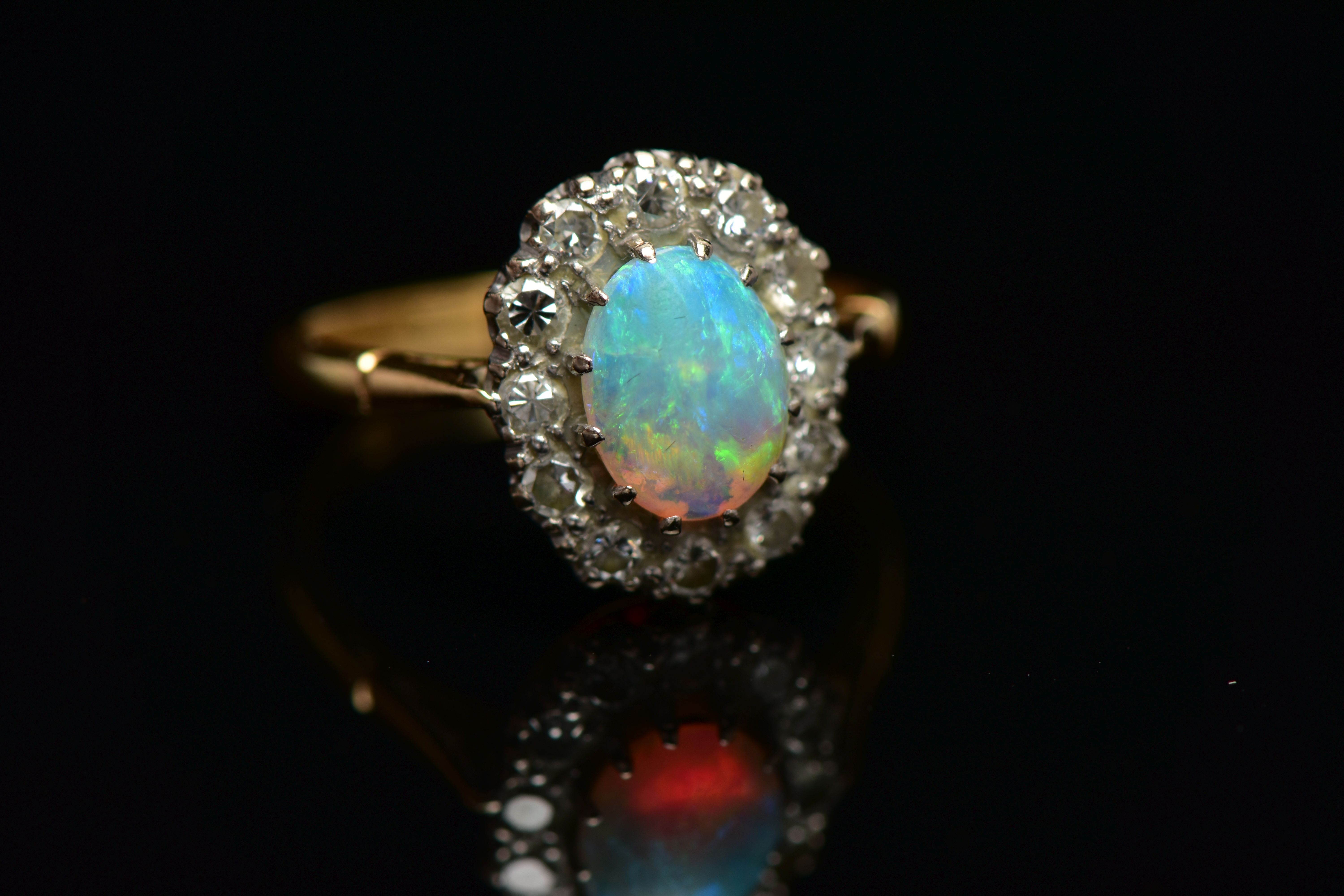 AN OPAL AND DIAMOND CLUSTER RING, set with an oval opal cabochon, measuring approximately 8.2mm x - Image 8 of 10