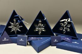 THREE BOXED SWAROVSKI ANNUAL CHRISTMAS ORNAMENTS 2008, 2009 AND 2010 (942045, 983702 and 1041301),