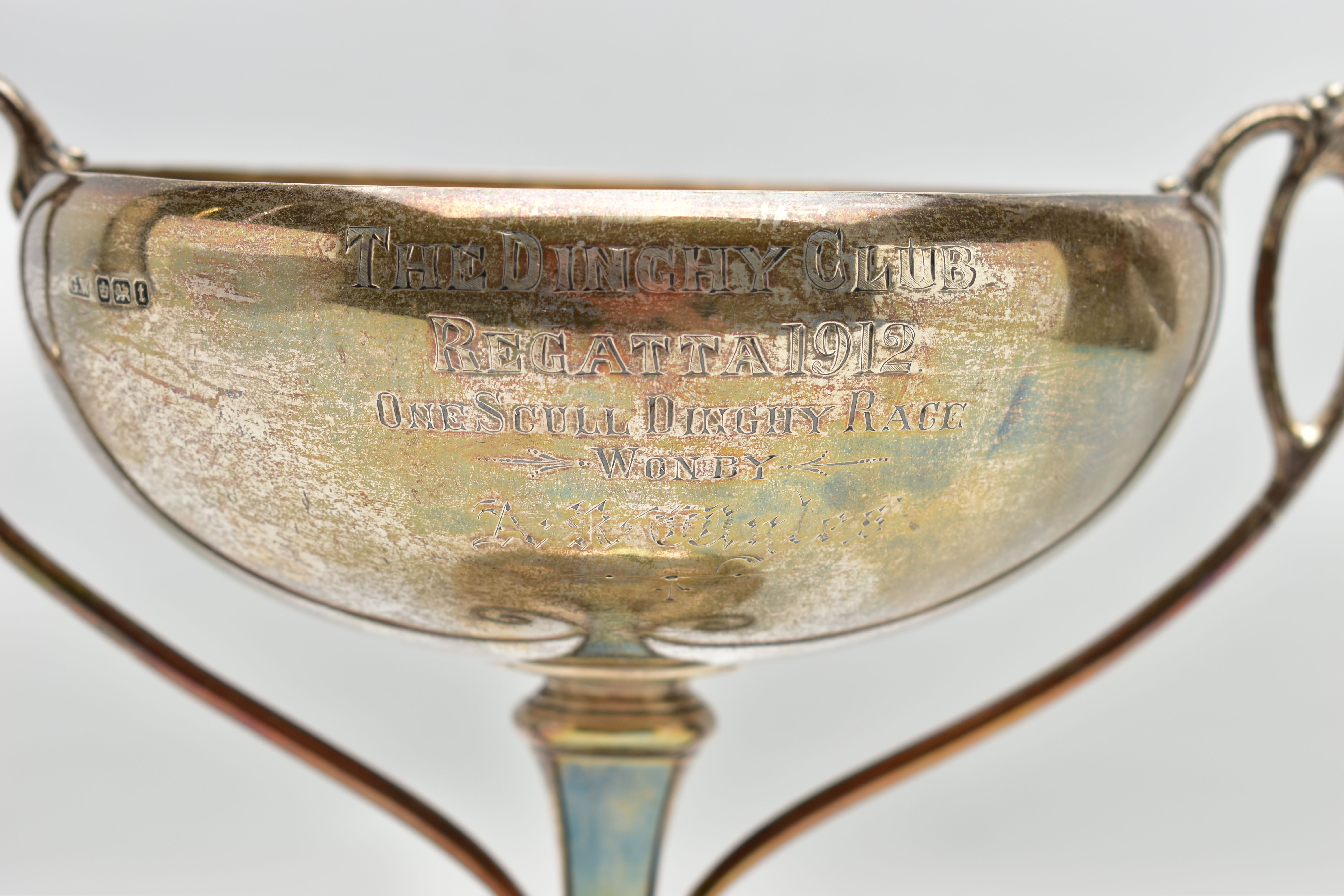 A GEORGE V SILVER TWIN HANDLED TROPHY CUP, the shallow silver cup on a slender pedestal with cast - Image 2 of 8