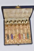 A CASED SET OF SIX SILVER GILT AND ENAMEL HARLEQUIN COFFEE SPOONS, marked 'Ela DENMARK STERLING