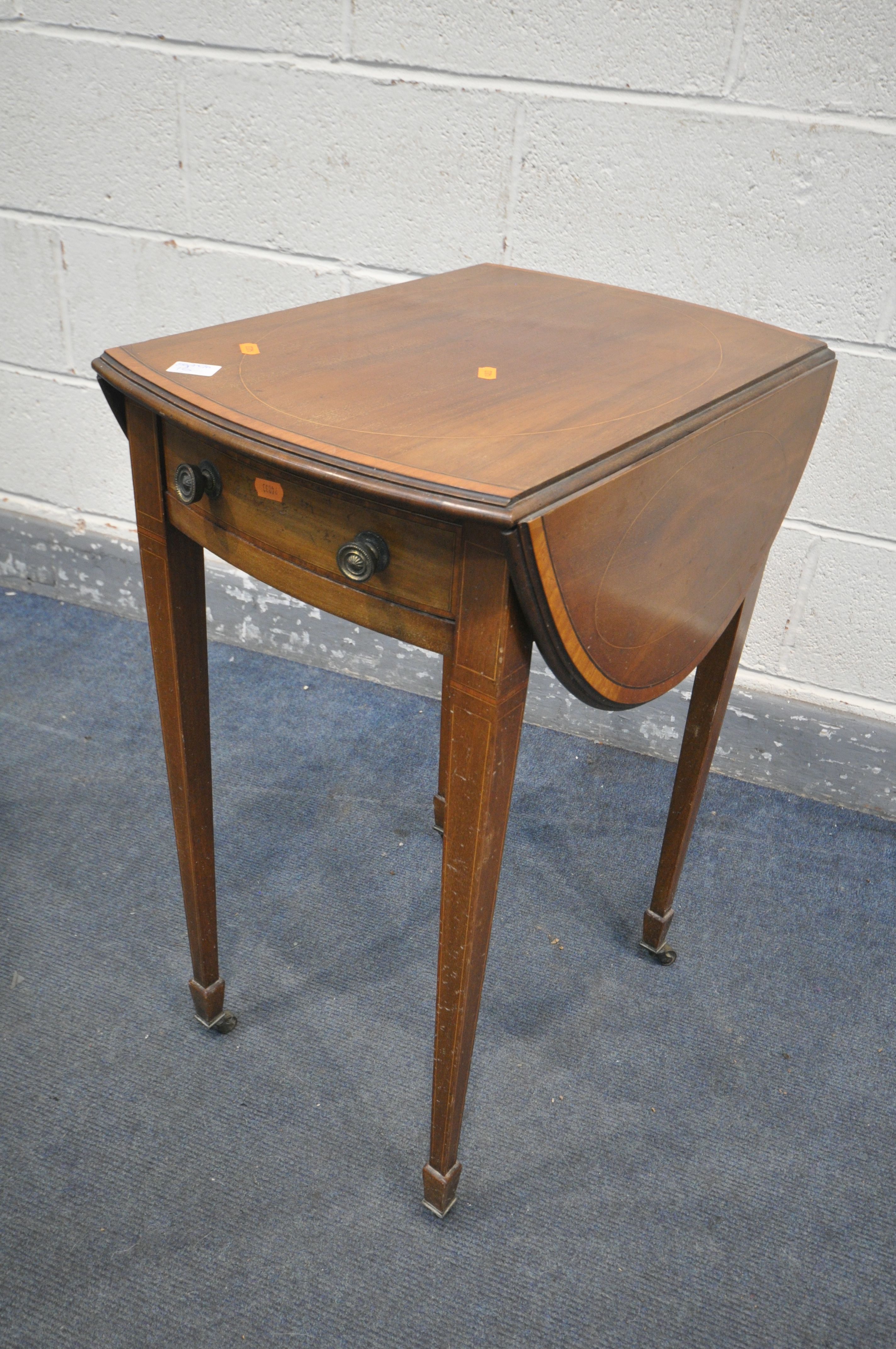 A REGENCY MAHOGANY AND BOXWOOD STRUNG BORDER PEMBROKE TABLE, of small proportions, the oval drop
