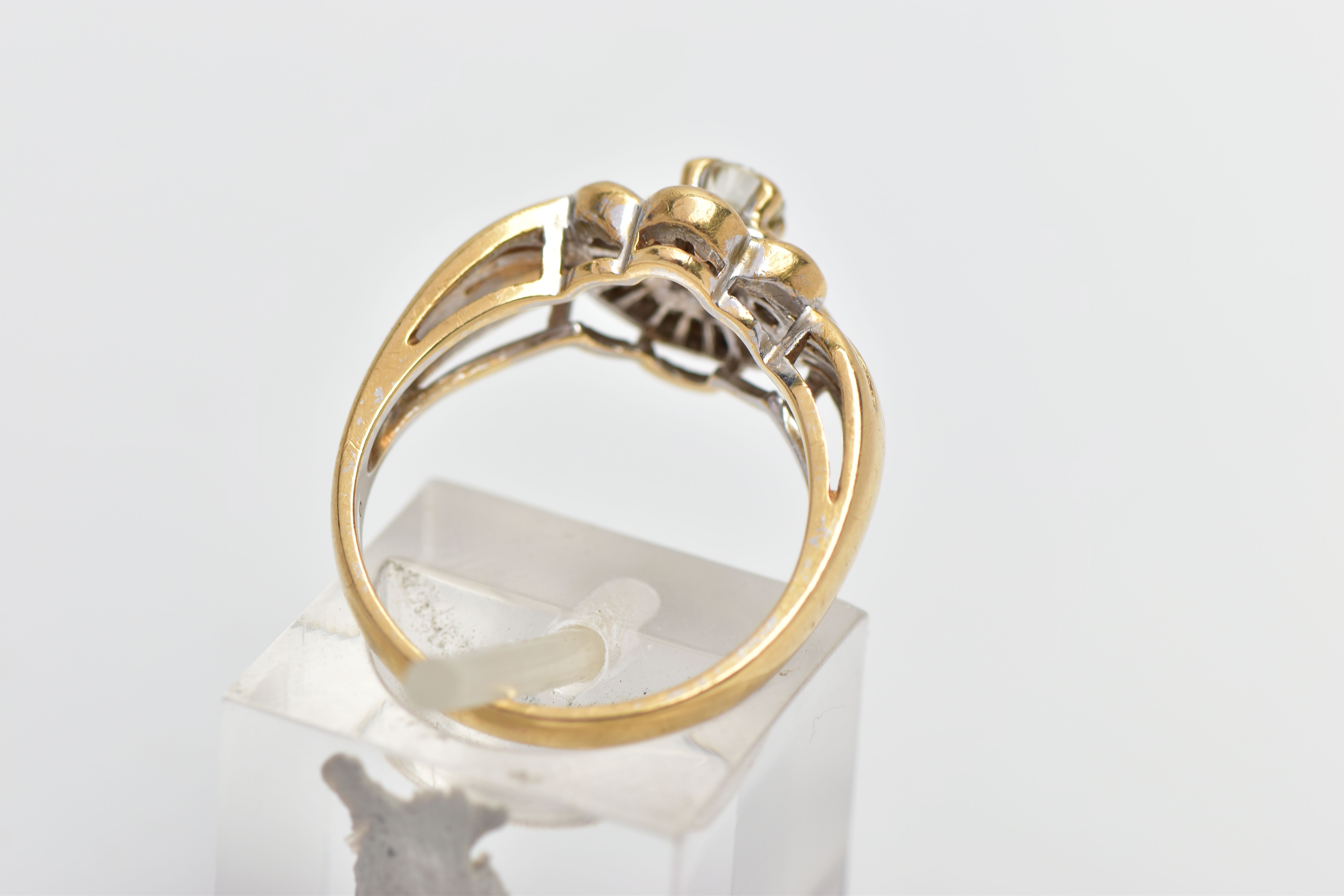 A MODERN YELLOW METAL DIAMOND CLUSTER RING, set with a principal round brilliant cut diamond, within - Image 3 of 8