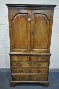 A GEORGIAN WALNUT CUPBOARD, the double fielded panel doors, enclosing a converted interior, with two