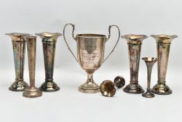 A SILVER TWIN HANDLED TROPHY CUP, A SET OF FOUR GEORGE V SILVER TRUMPET SHAPED POSY VASES AND