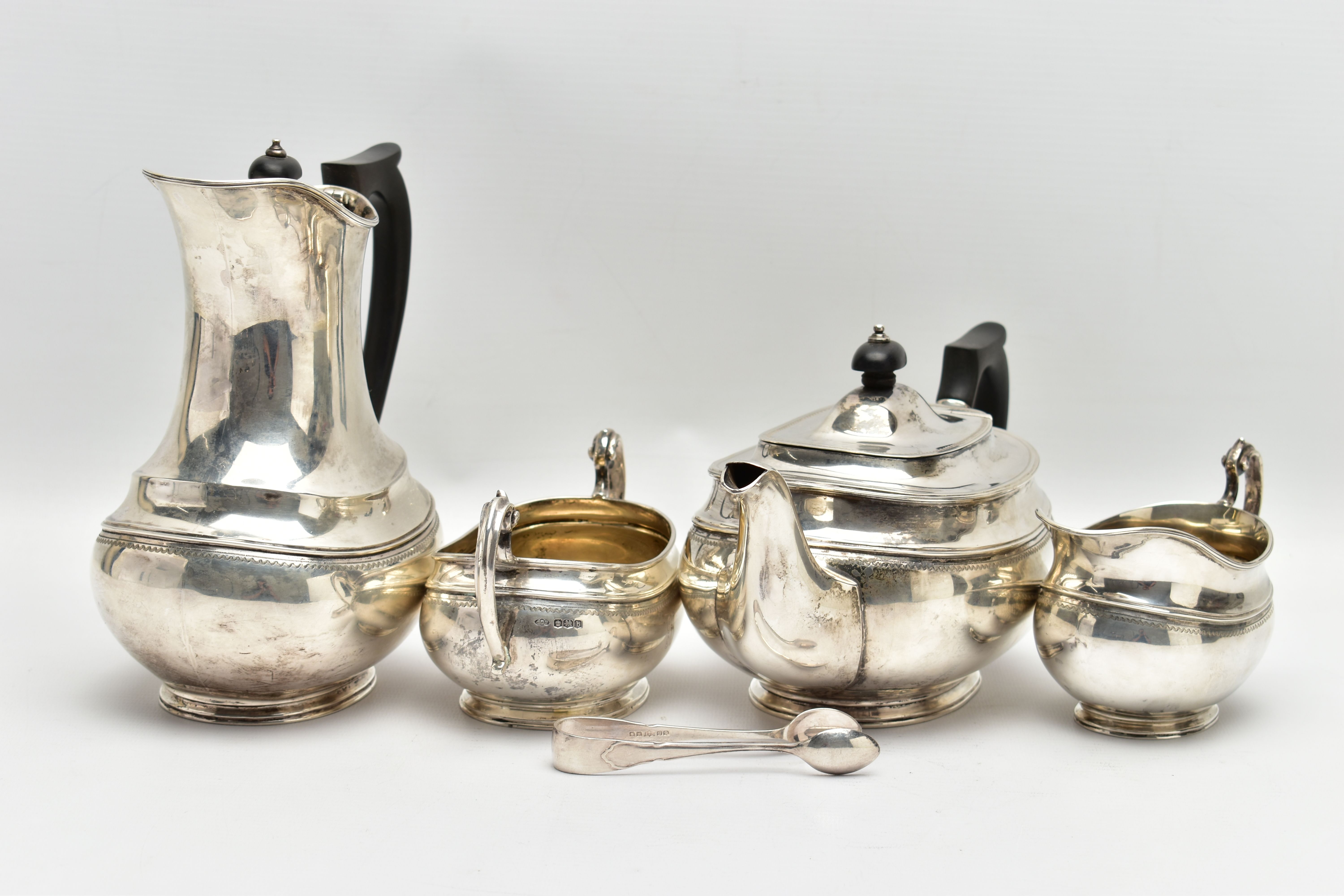 A GEORGE V SILVER FOUR PIECE TEA SERVICE OF OVAL FORM, comprising tea pot, hot water/coffee jug, - Image 5 of 9