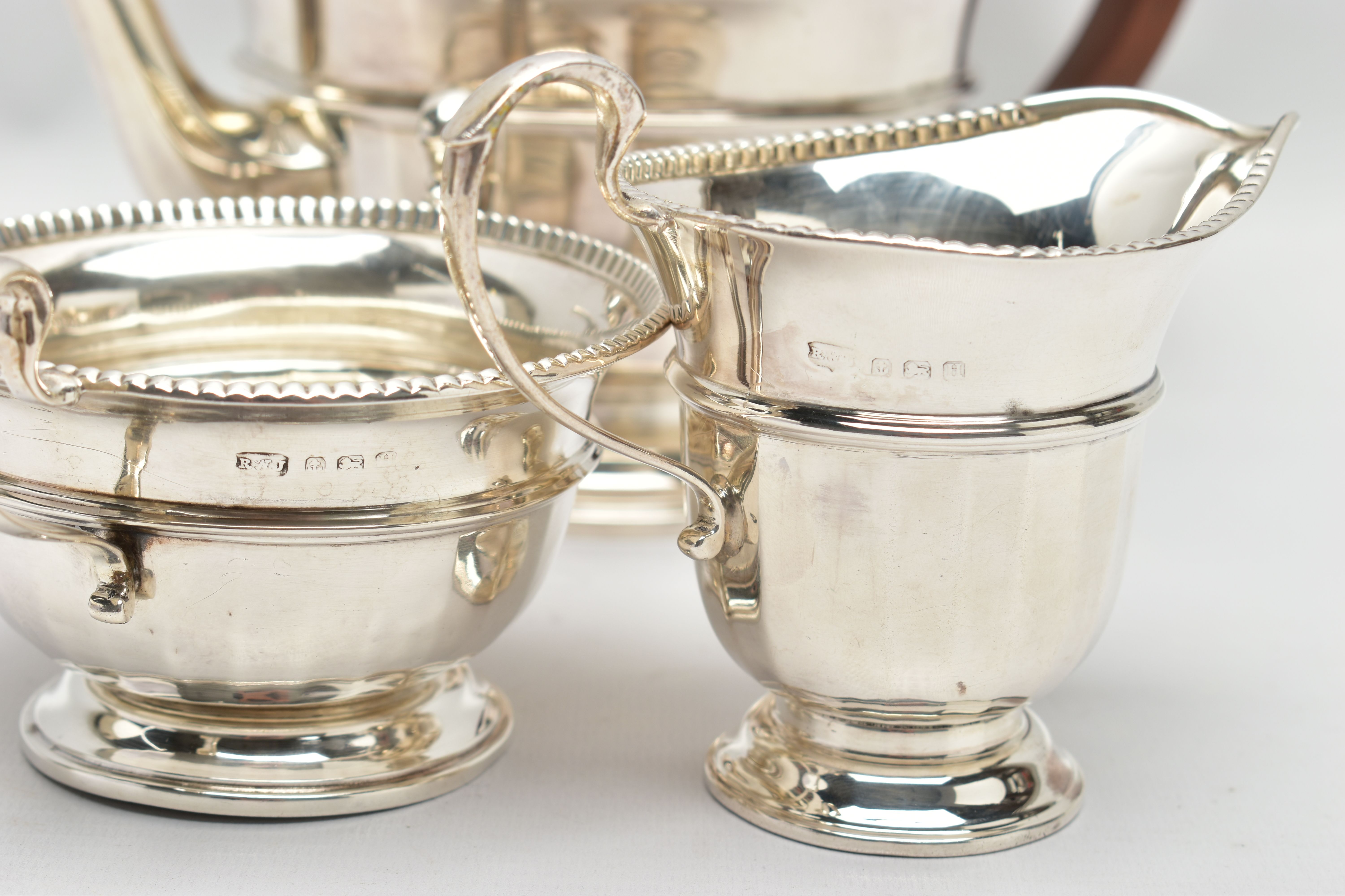 A GEORGE V SILVER THREE PIECE TEA SERVICE OF CIRCULAR PANELLED FORM, reeded rims, S scroll - Image 7 of 9