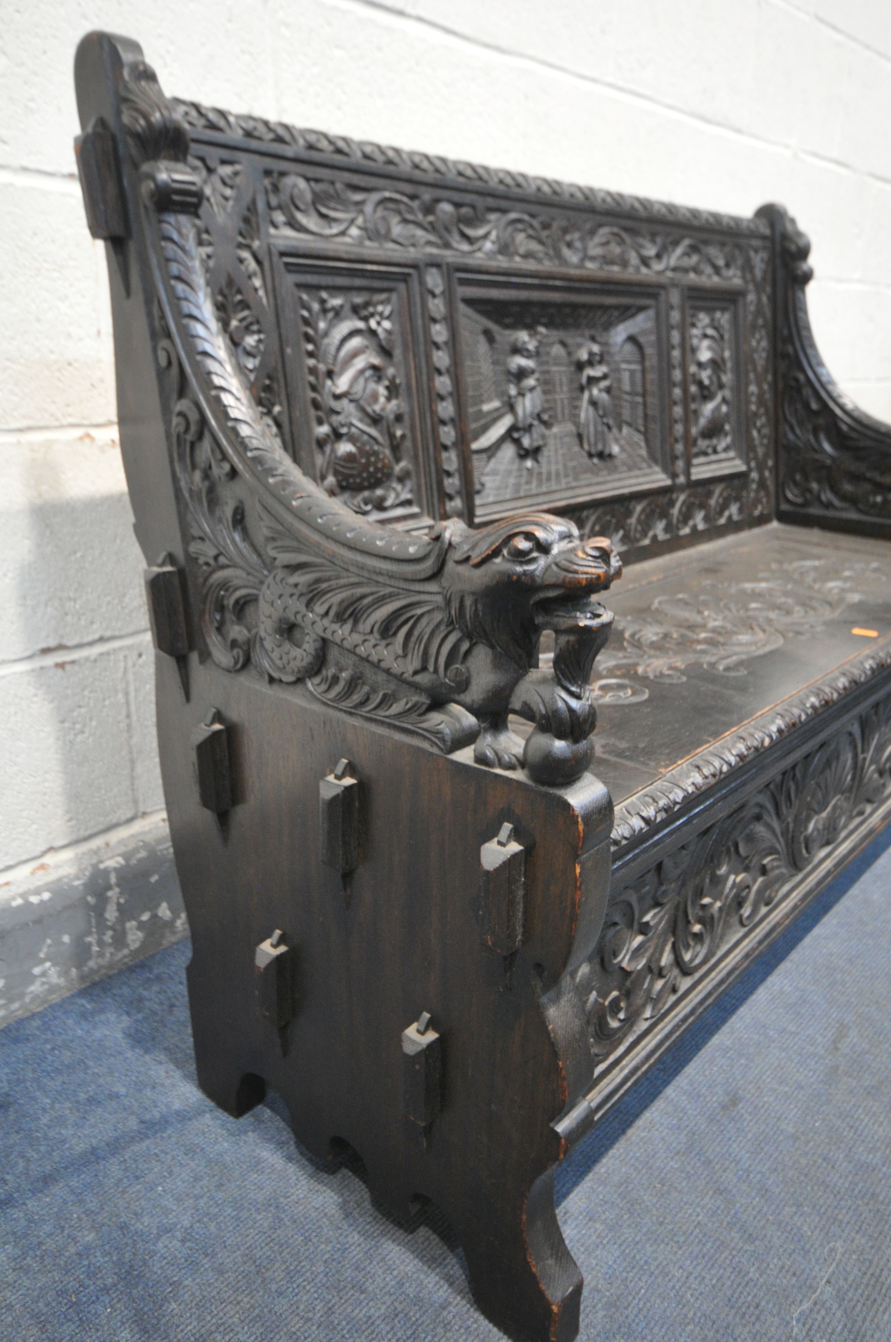 A LATE 19TH CENTURY CARVED OAK JACOBETHAN STYLE HALL SETTLE/BENCH, the two outer panels depicting - Image 9 of 9