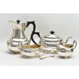A GEORGE V SILVER FOUR PIECE TEA SERVICE OF OVAL FORM, comprising tea pot, hot water/coffee jug,