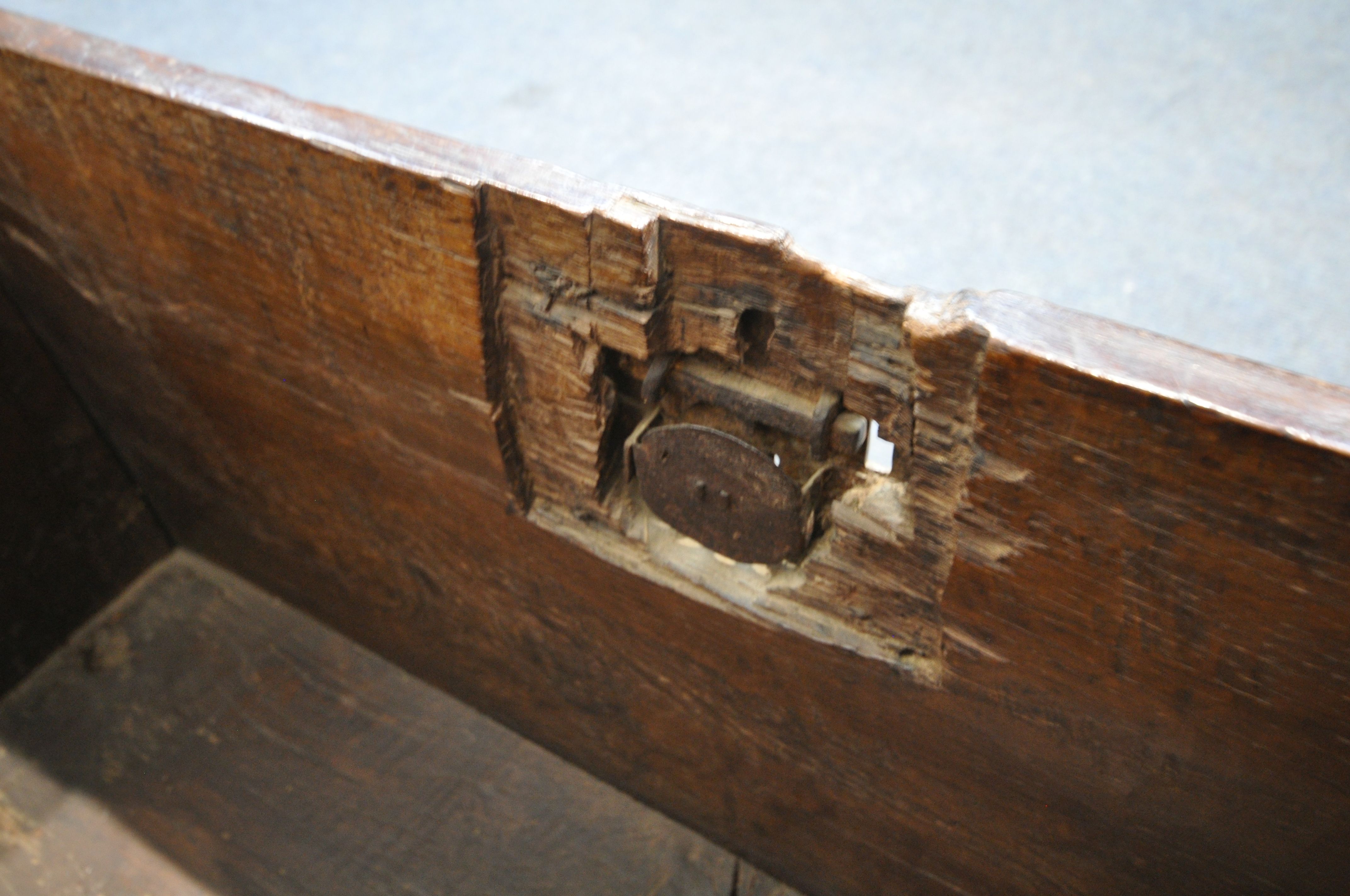 A 17TH CENTURY OAK COFFER, made up of six planks, the carved front with depicting two standing males - Image 6 of 9