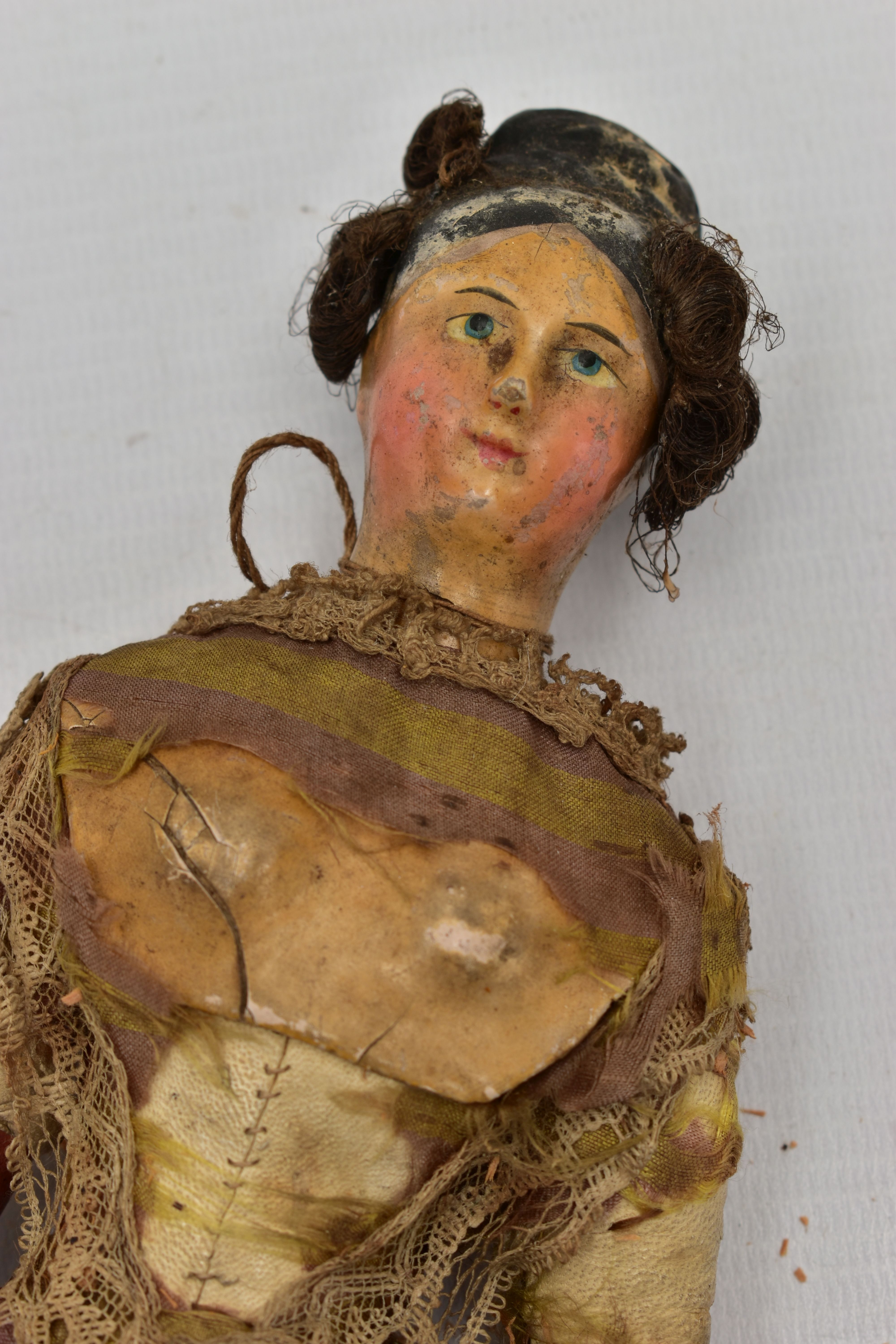 AN EARLY 19TH CENTURY PAPIER MACHE, LEATHER AND WOODEN DOLL, black painted high bun with inserted - Image 2 of 9