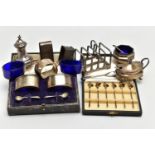 A PARCEL OF SILVER CRUET ITEMS, NAPKIN RINGS, TOAST RACK, ETC, including a cased set of six cocktail