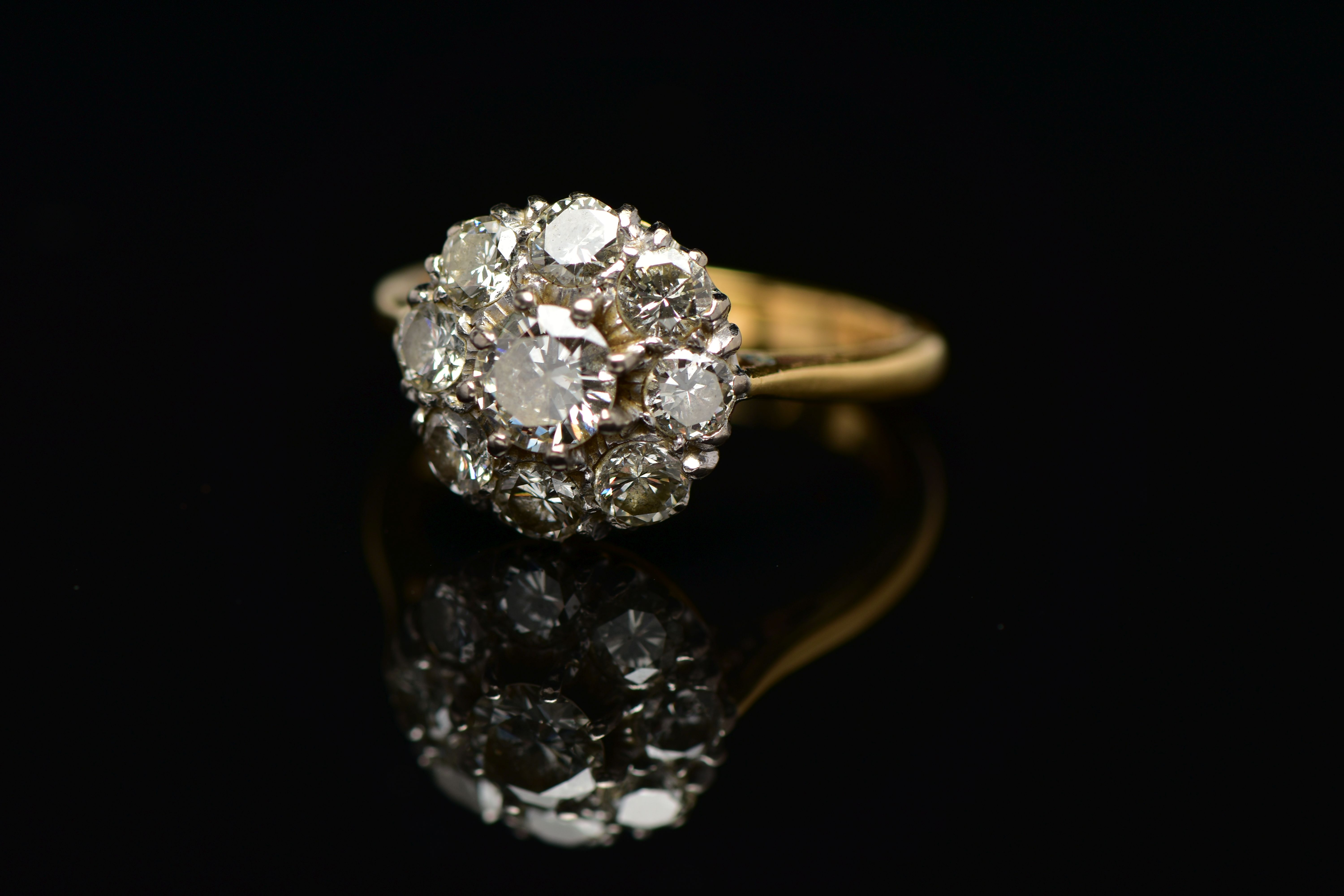 A DIAMOND NINE STONE CLUSTER RING, set with a principal round brilliant cut diamond, surrounded by - Image 9 of 9