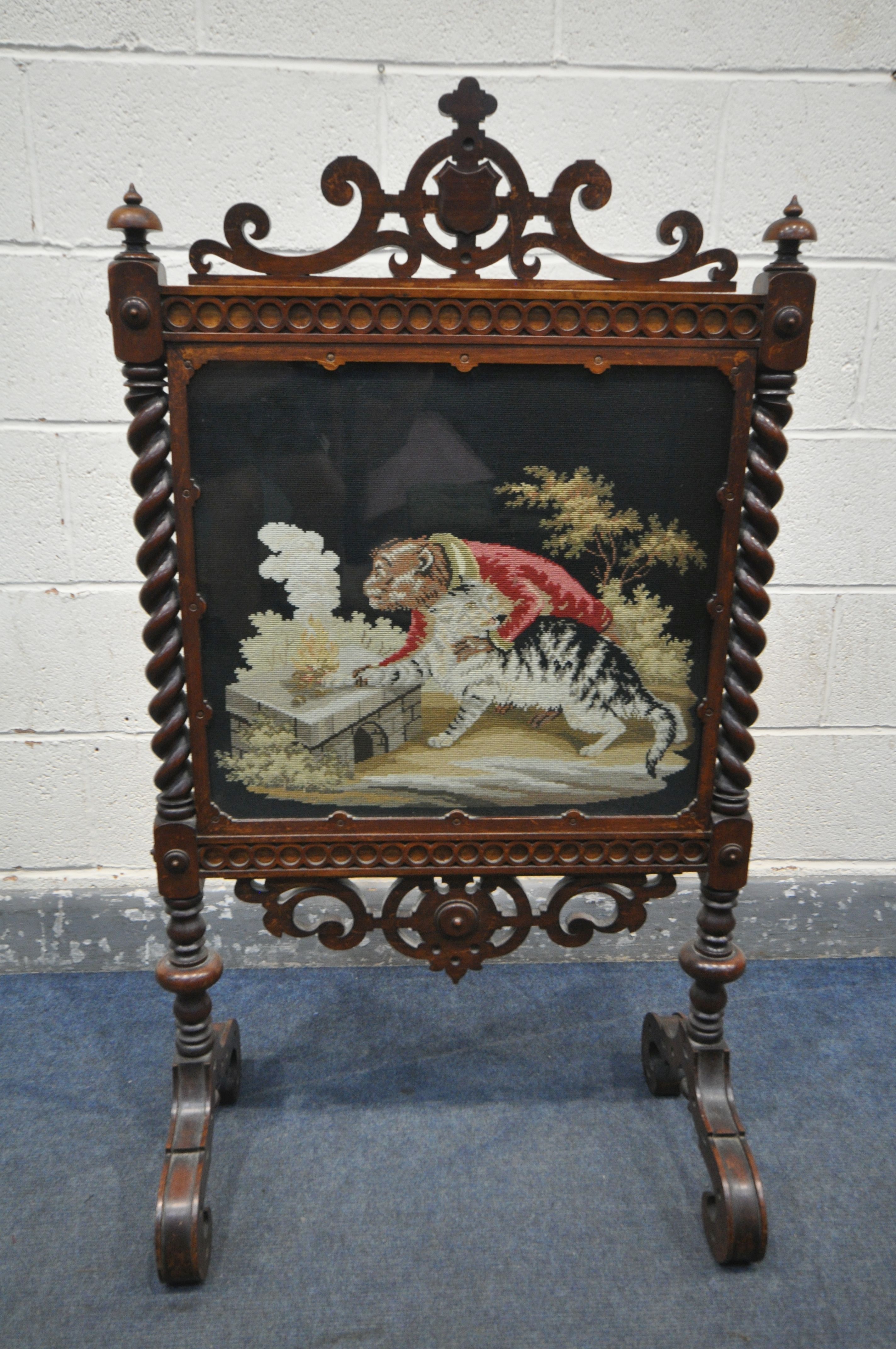 A VICTORIAN WALNUT FIRESCREEN, with open scrolls and central shield, turned finials, barley twist - Image 2 of 5