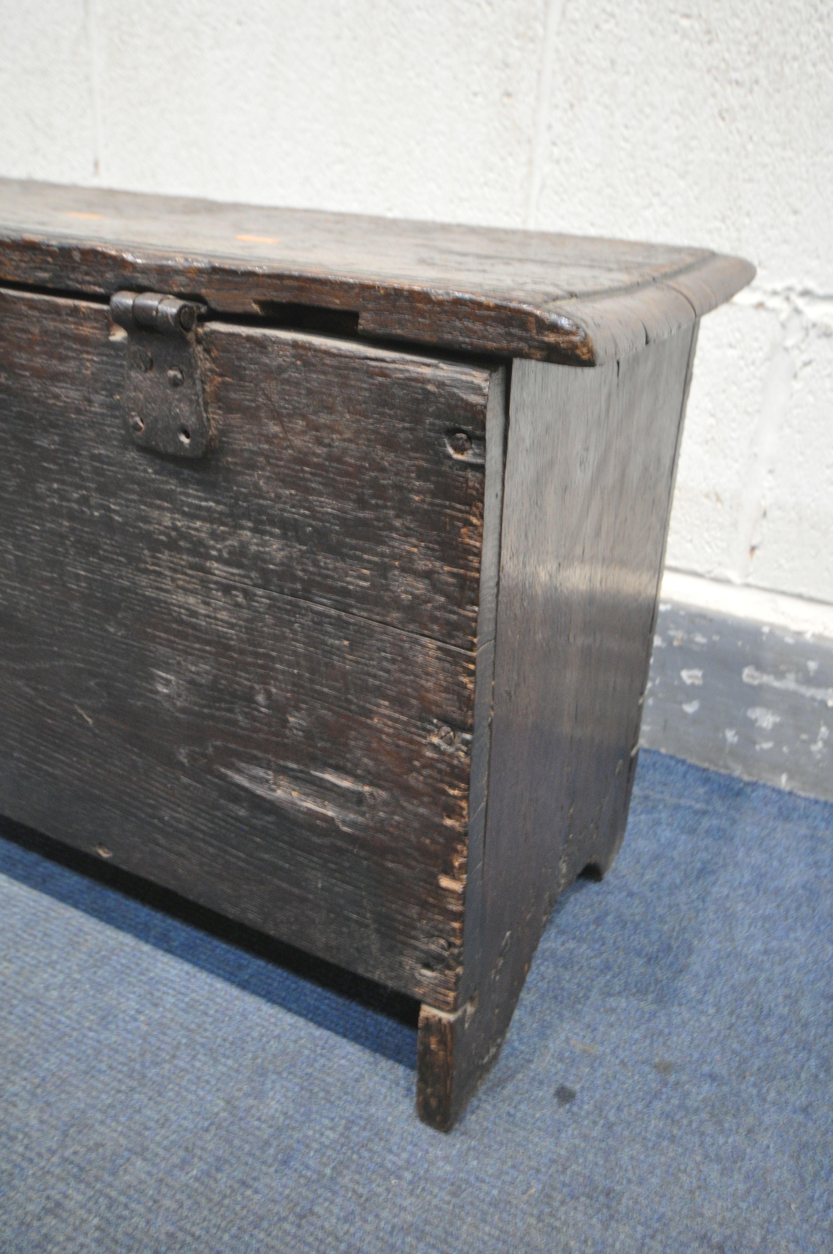 A 17TH CENTURY OAK COFFER, made up of six planks, the carved front with depicting two standing males - Image 8 of 9