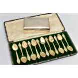 A CASED SET OF TWELVE LATE VICTORIAN SILVER GILT ICE CREAM SPOONS, foliate decoration to the
