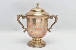 A GEORGE V SILVER TWIN HANDLED TROPHY CUP AND COVER, the pull off domed cover with foliate ball