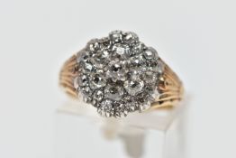 A GEORGIAN DIAMOND CLUSTER RING, set with a principal old mine cut diamond, measuring