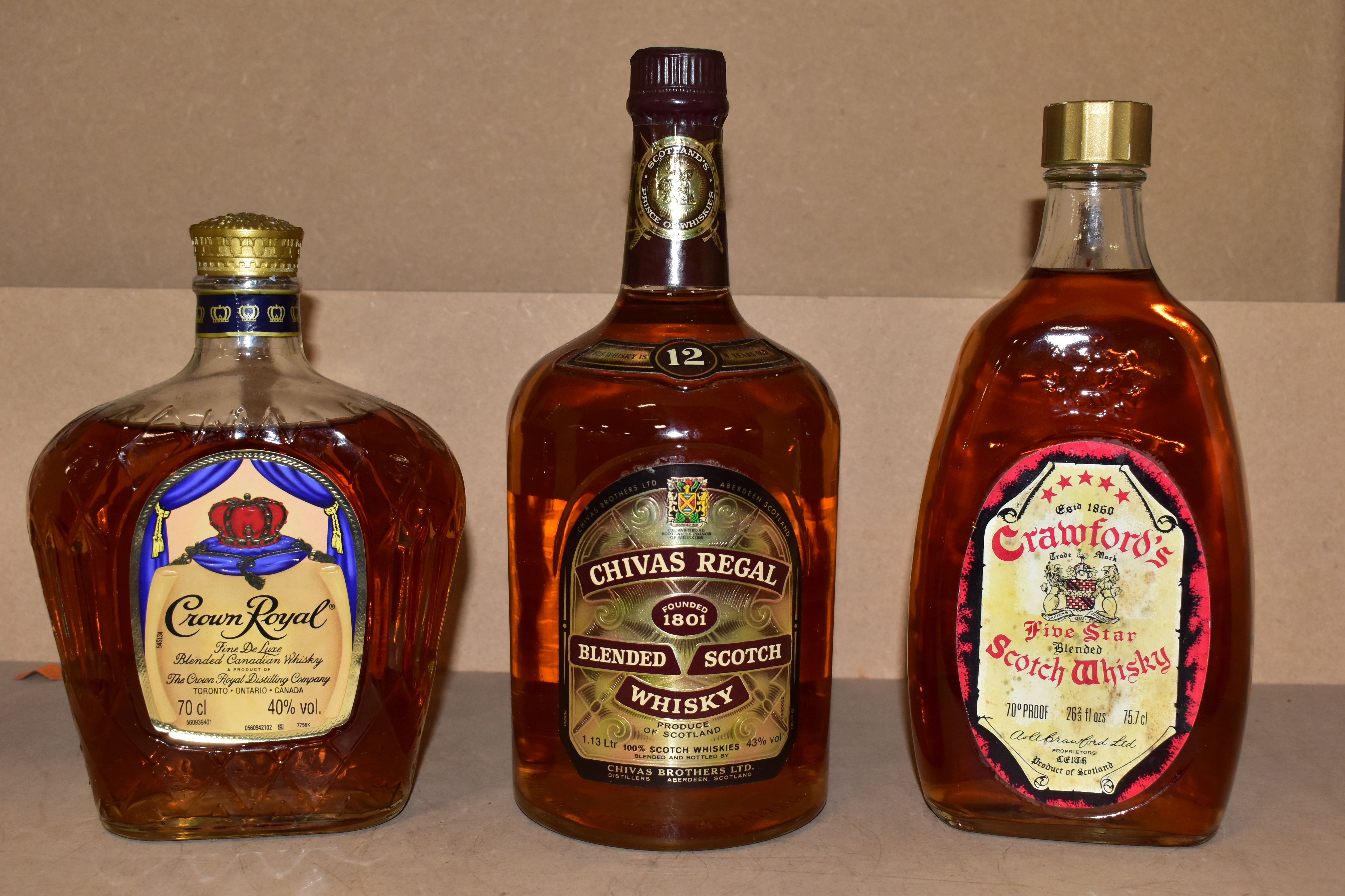 WHISKY, three bottles comprising one vintage bottle of CRAWFORD'S five star blended Scotch Whisky,