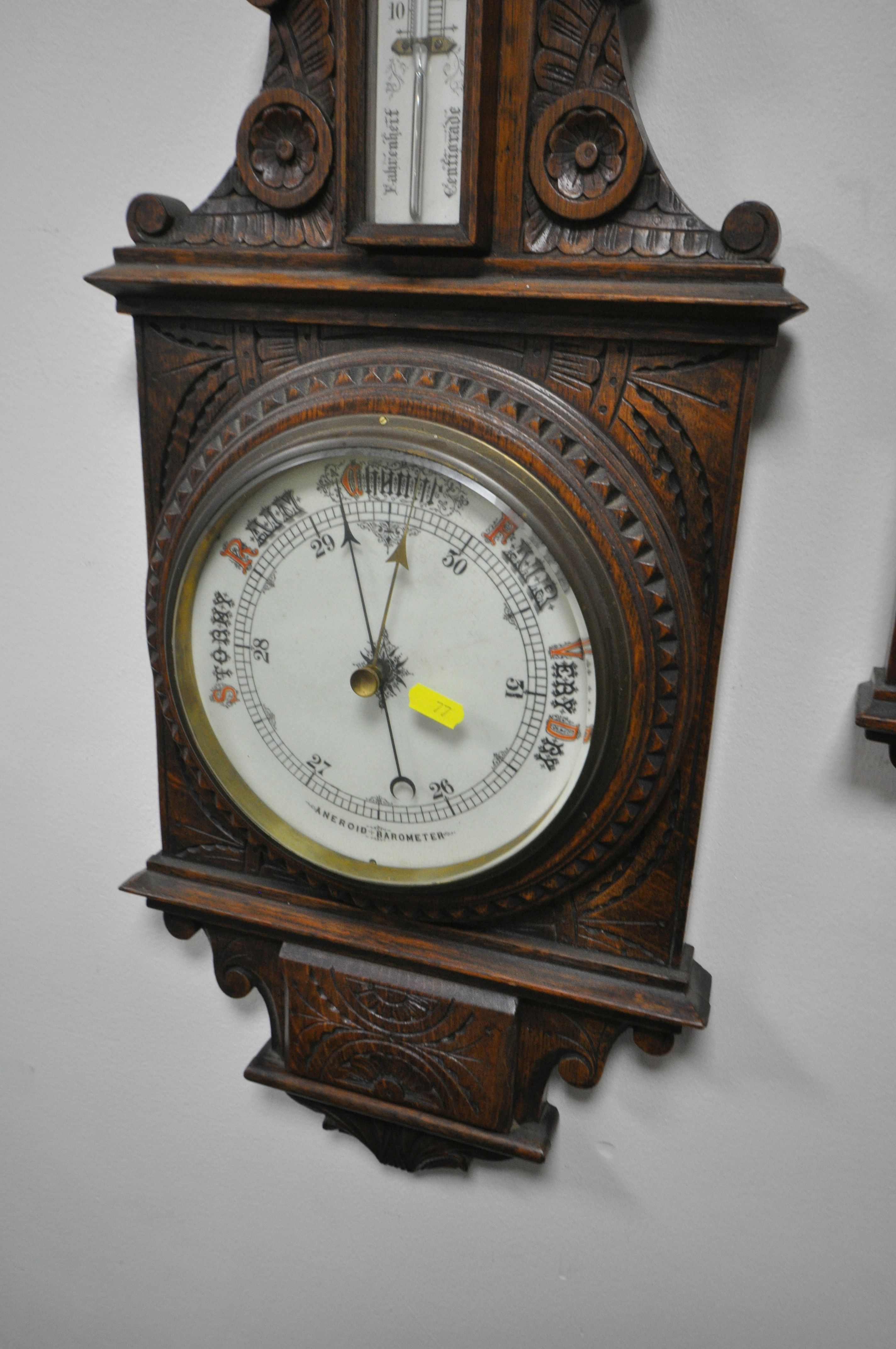 TWO LATE 19TH/EARLY 20TH CENTURY CARVED OAK ANEROID BAROMETERS, with clock dials and thermometers, - Image 3 of 5