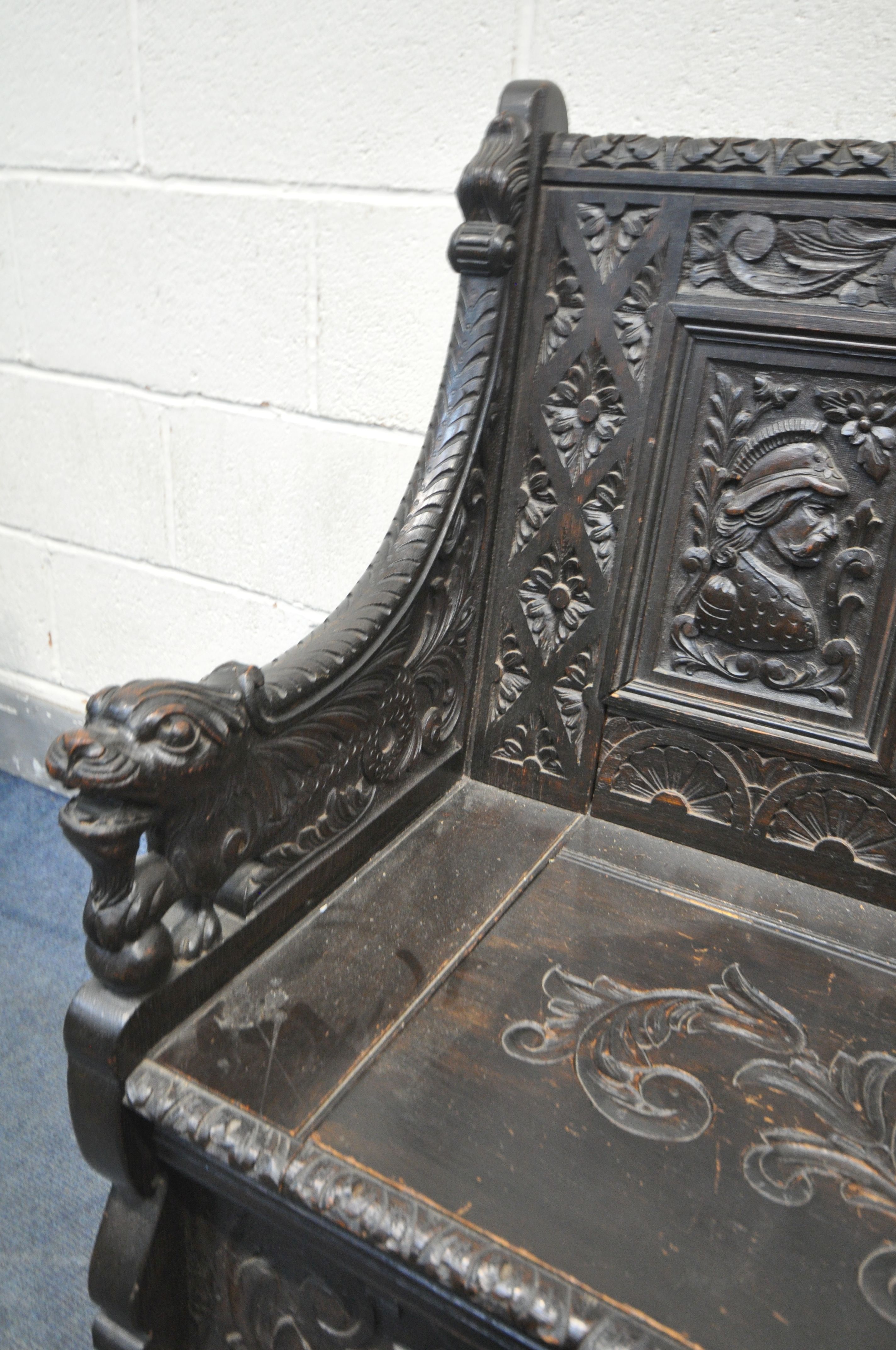A LATE 19TH CENTURY CARVED OAK JACOBETHAN STYLE HALL SETTLE/BENCH, the two outer panels depicting - Image 8 of 9