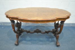 A VICTORIAN BURR WALNUT CENTRE TABLE, the oval serpentine top being quarter veneered, on a base with