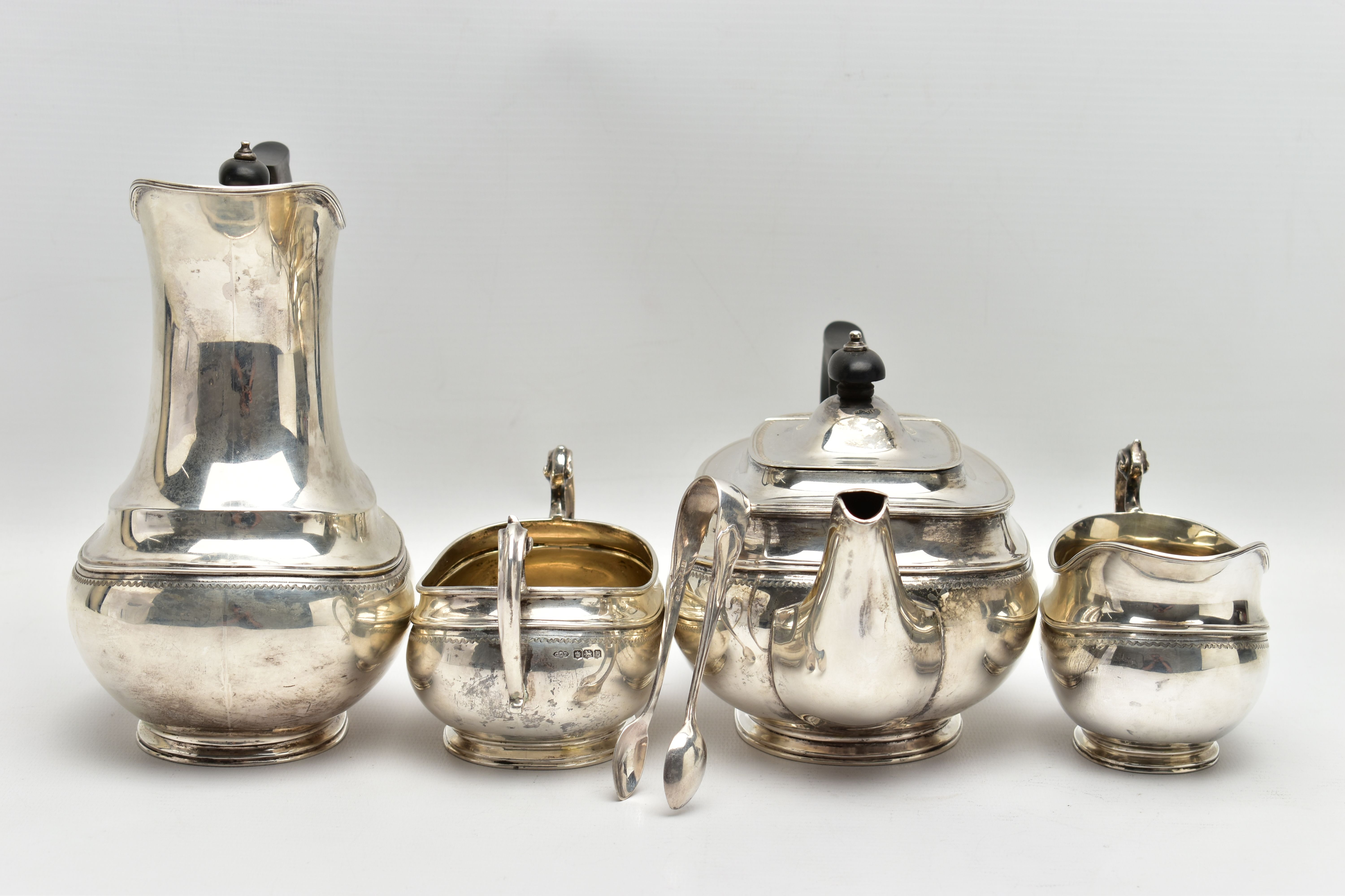 A GEORGE V SILVER FOUR PIECE TEA SERVICE OF OVAL FORM, comprising tea pot, hot water/coffee jug, - Image 9 of 9