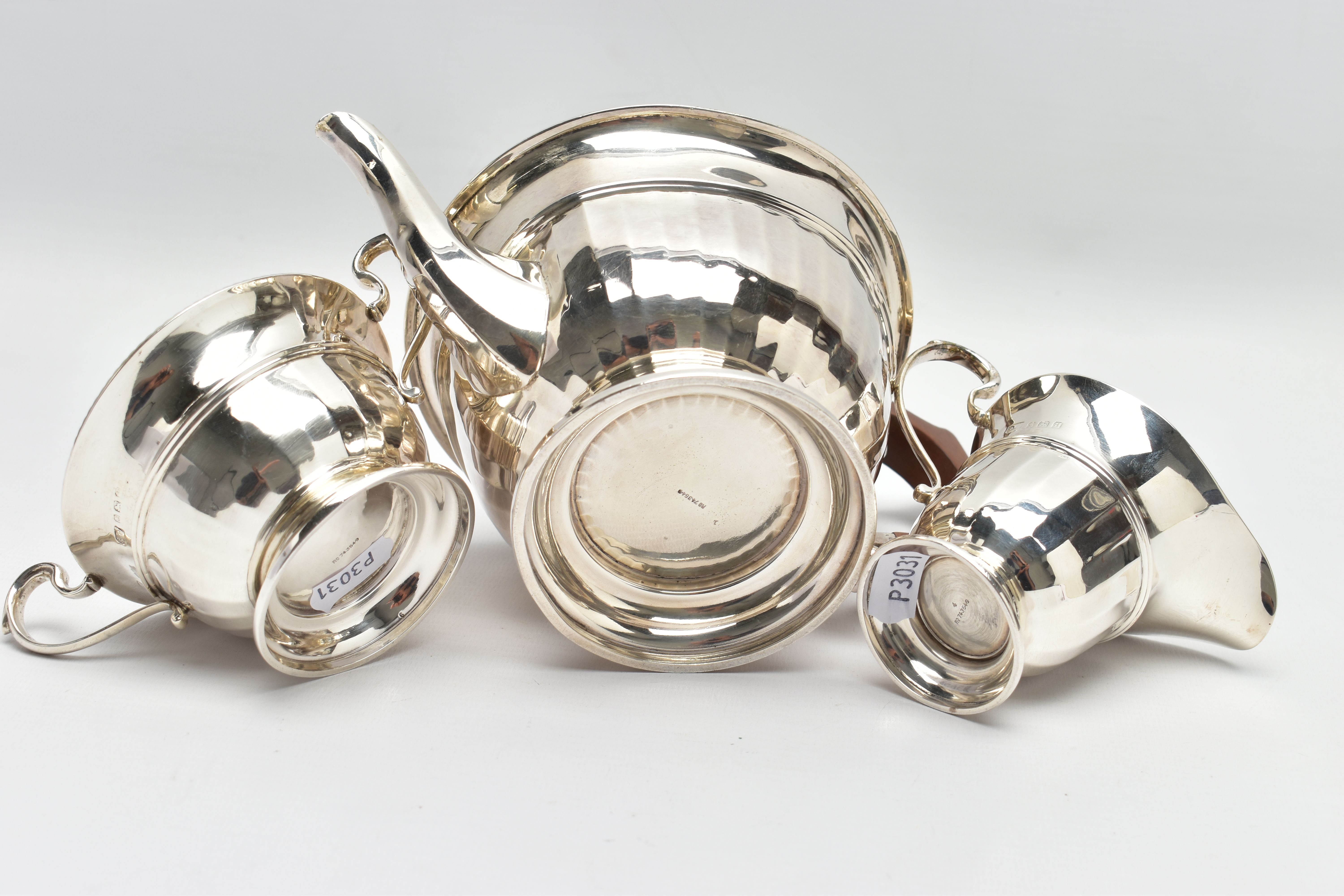 A GEORGE V SILVER THREE PIECE TEA SERVICE OF CIRCULAR PANELLED FORM, reeded rims, S scroll - Image 9 of 9