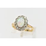 AN OPAL AND DIAMOND CLUSTER RING, set with an oval opal cabochon, measuring approximately 8.2mm x