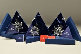 THREE BOXED SWAROVSKI ANNUAL CHRISTMAS ORNAMENTS 2002, 2003 AND 2004 (288802, 622498 and 631562),