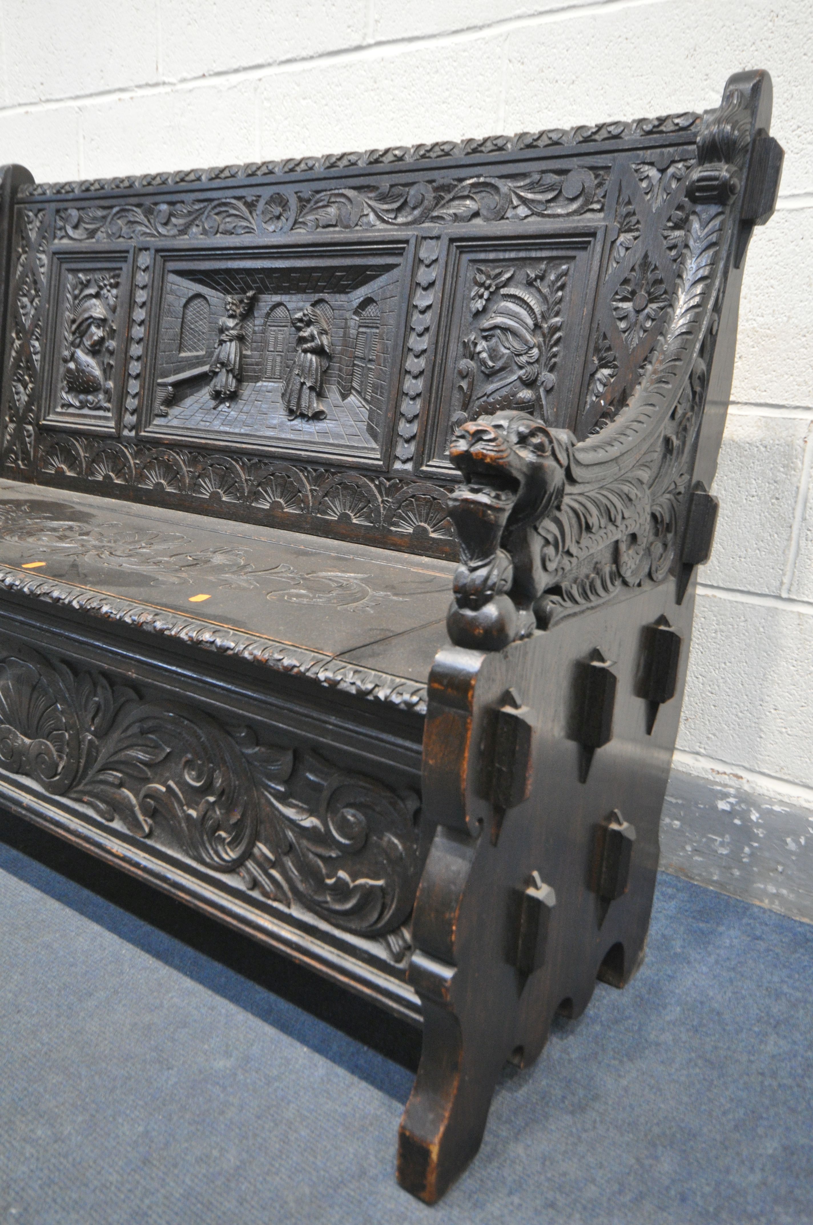 A LATE 19TH CENTURY CARVED OAK JACOBETHAN STYLE HALL SETTLE/BENCH, the two outer panels depicting - Image 2 of 9