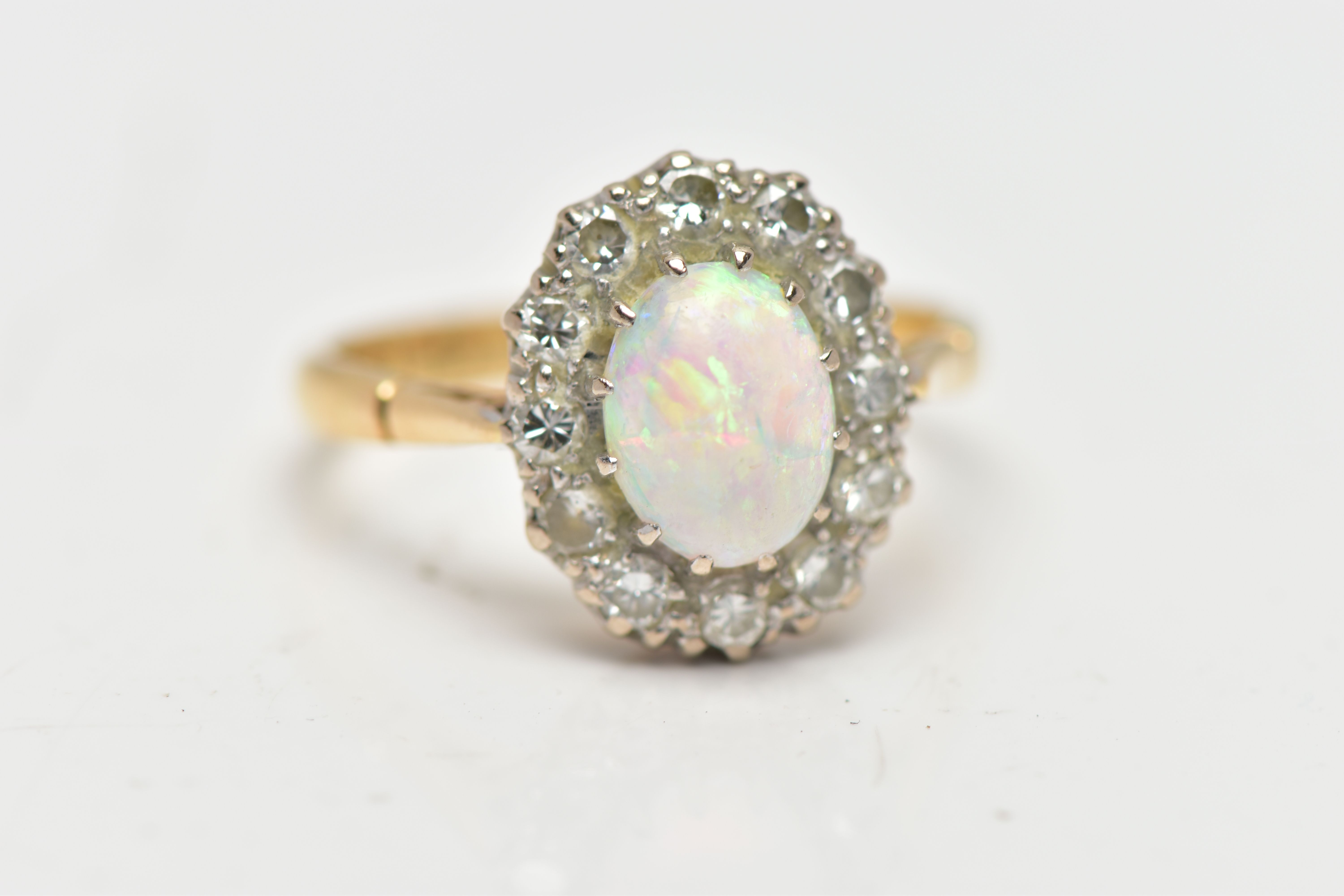 AN OPAL AND DIAMOND CLUSTER RING, set with an oval opal cabochon, measuring approximately 8.2mm x - Image 6 of 10