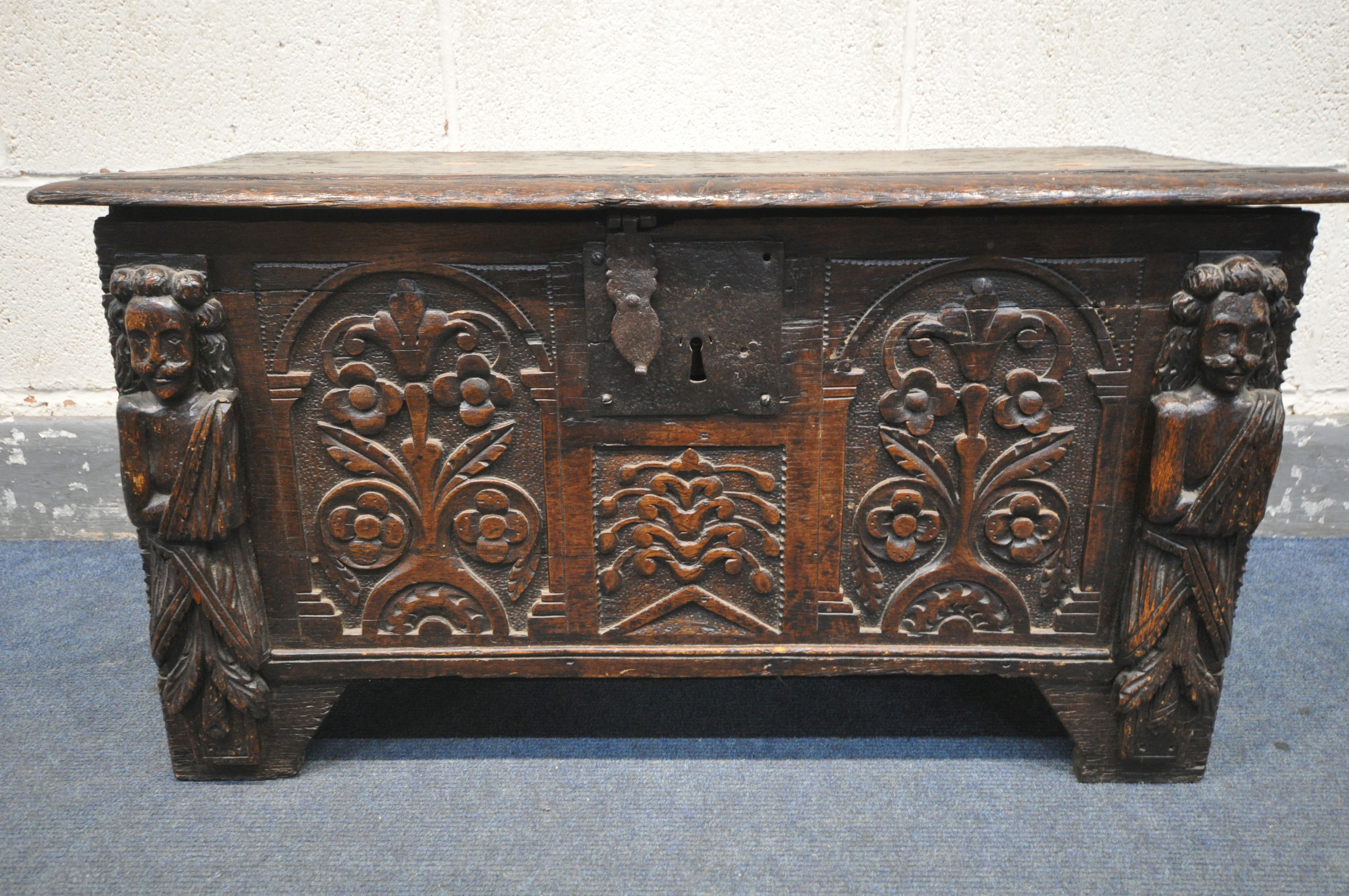 A 17TH CENTURY OAK COFFER, made up of six planks, the carved front with depicting two standing males - Image 2 of 9