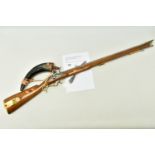 A HIGH QUALITY REPLICA OF AN ENGLISH BAKER FLINTLOCK RIFLE, its barrel is only partially bored