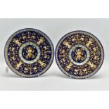 A PAIR OF GINORI FAIENCE STYLE EARTHENWARE PLATES, the dark blue ground decorated in relief with