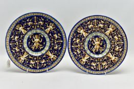 A PAIR OF GINORI FAIENCE STYLE EARTHENWARE PLATES, the dark blue ground decorated in relief with