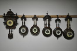 SIX LATE 19TH/EARLY 20TH CENTURY CARVED WOOD BAROMETERS, all unsigned (6) (condition:-two missing