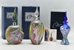 THREE BOXED OKRA GLASS IRIDESCENT SCENT BOTTLES AND STOPPERS, comprising an ovoid bottle with spiral