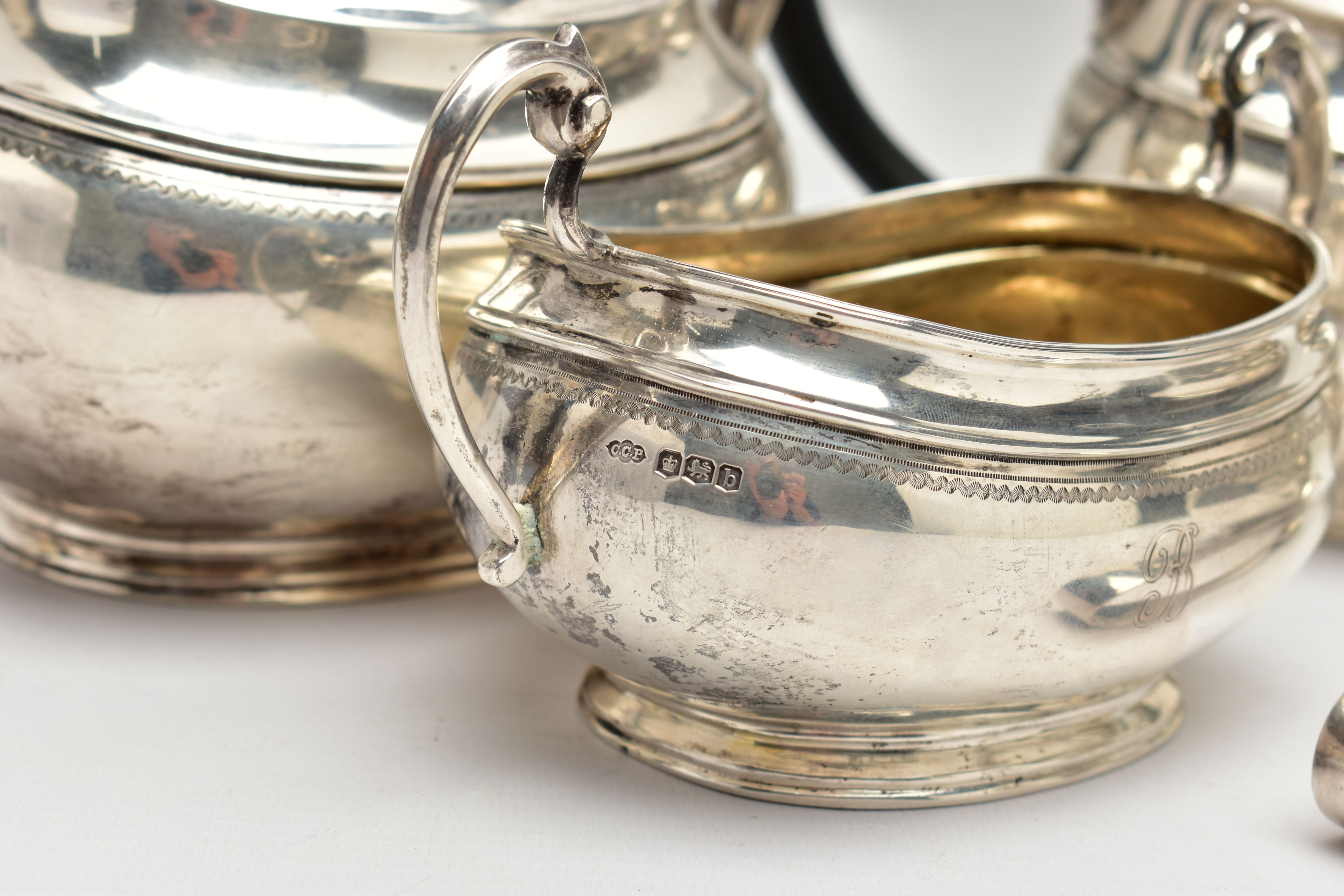 A GEORGE V SILVER FOUR PIECE TEA SERVICE OF OVAL FORM, comprising tea pot, hot water/coffee jug, - Image 3 of 9