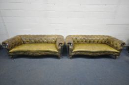 A PAIR OF EARLY 20TH CENTURY VICTORIAN STYLE OLIVE GREEN LEATHER SERPENTINE CHESTERFIELD SOFAS, on