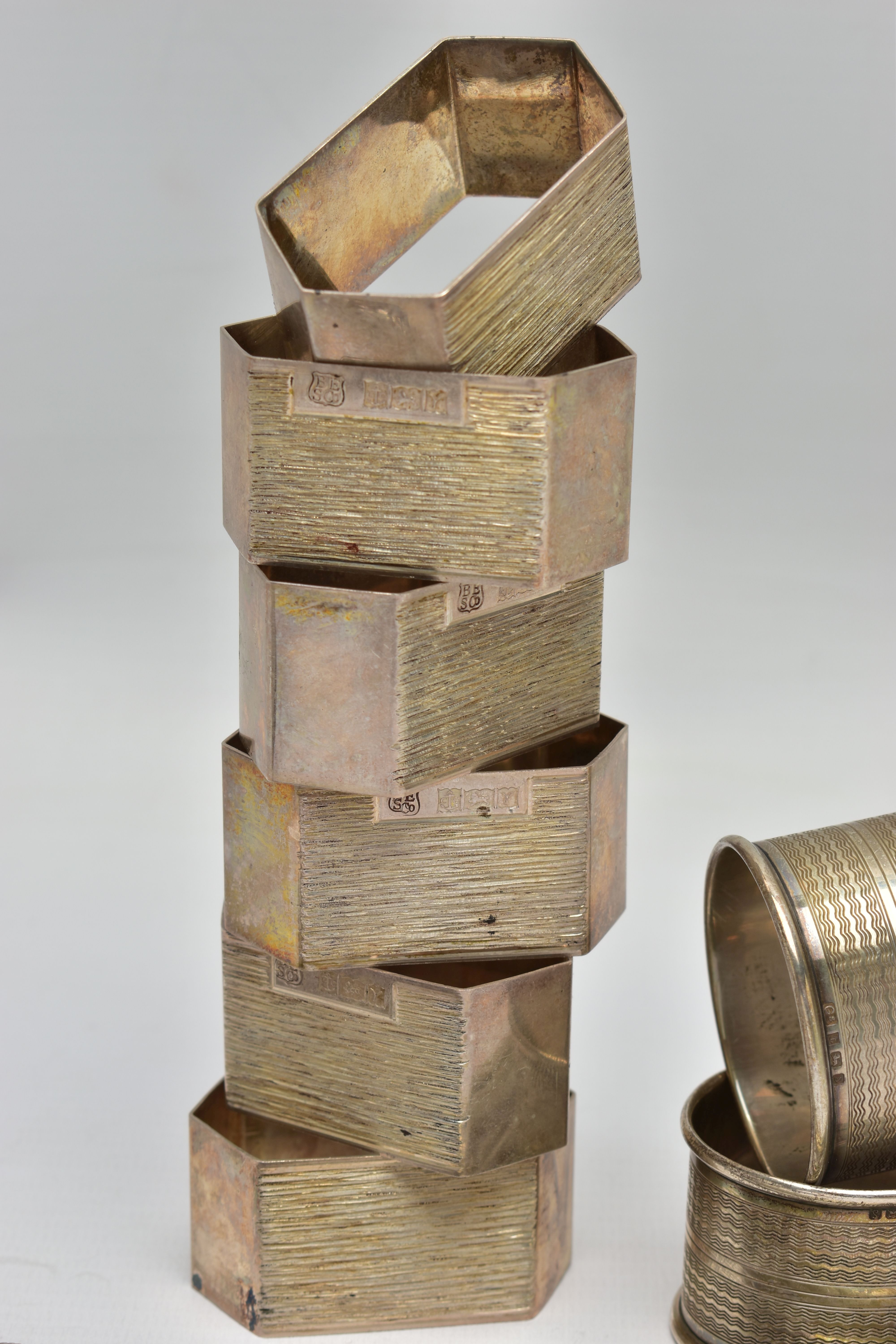 A SET OF SIX ELIZABETH II SILVER SHAPED HEXAGONAL NAPKIN RINGS, bark effect decoration, makers - Image 4 of 7